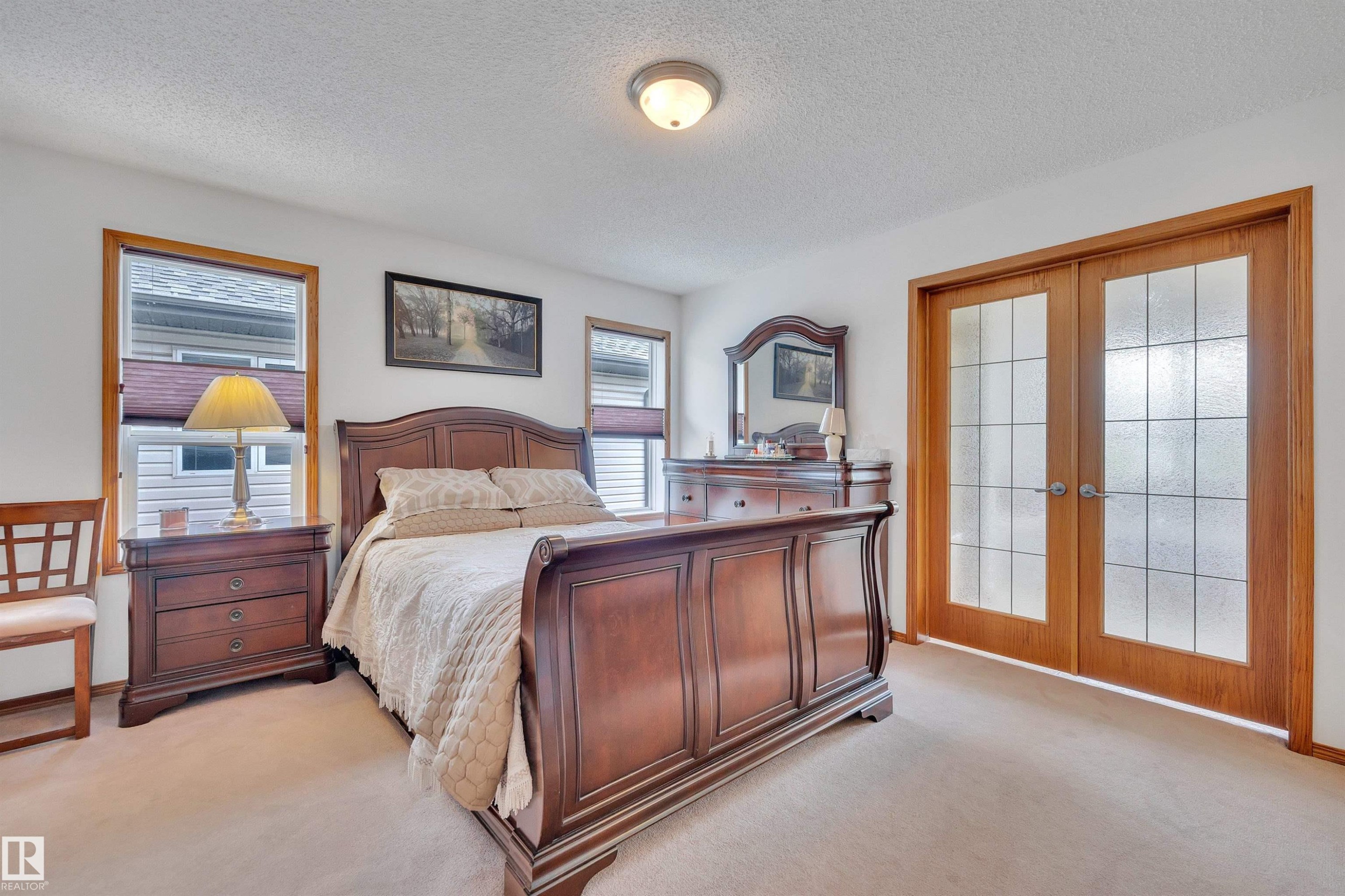 Plush carpeting throughout, paired with light wood trim around windows and doors - 16512 87 Street Nw, Edmonton, AB - Indoor Photo Showing Bedroom