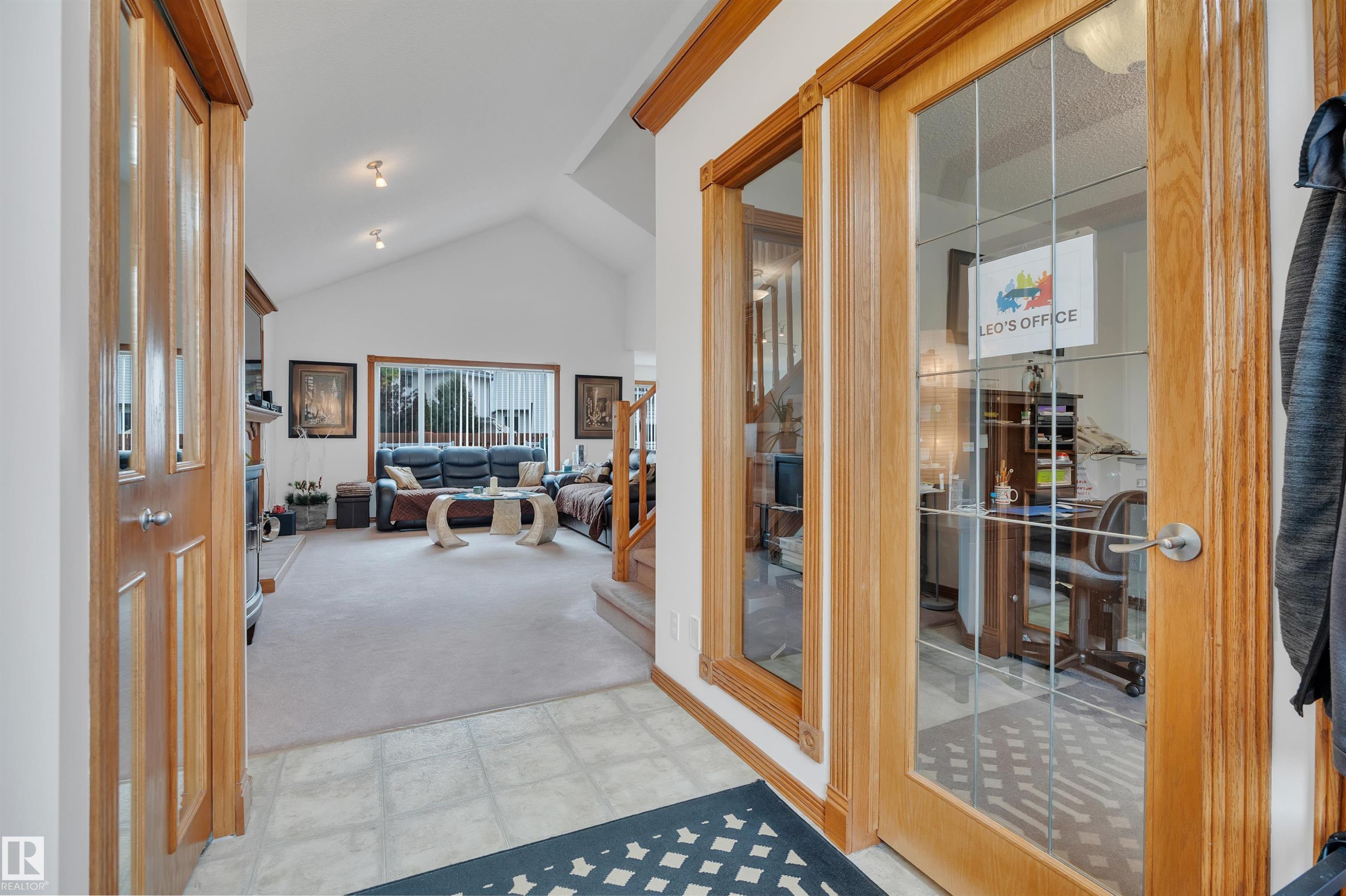 Entryway featuring tile flooring, wood-finish trim, and a glass-paneled door - 16512 87 Street Nw, Edmonton, AB - Indoor Photo Showing Other Room