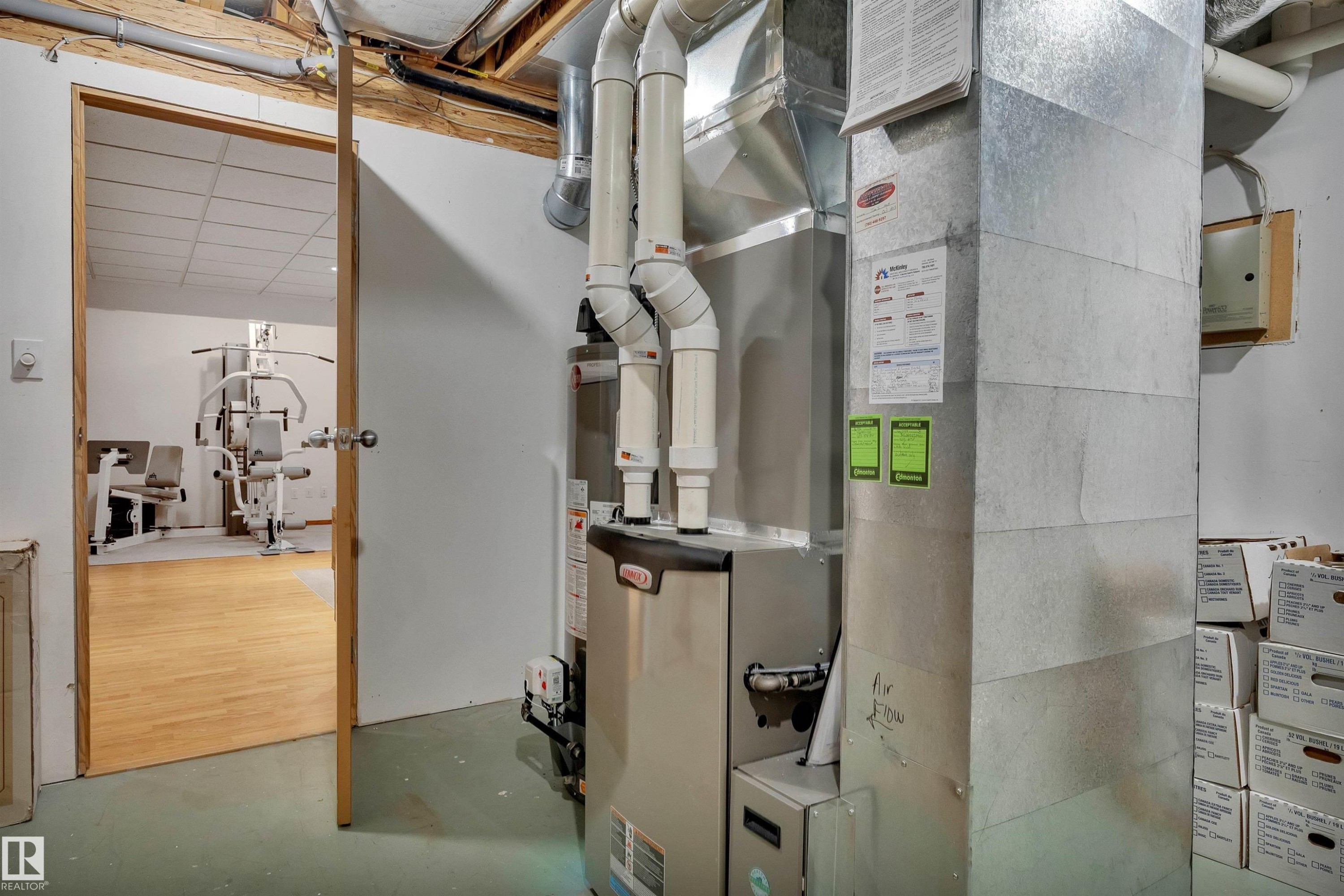 Utility room featuring a furnace with visible ductwork and piping - 16512 87 Street Nw, Edmonton, AB - Indoor Photo Showing Basement