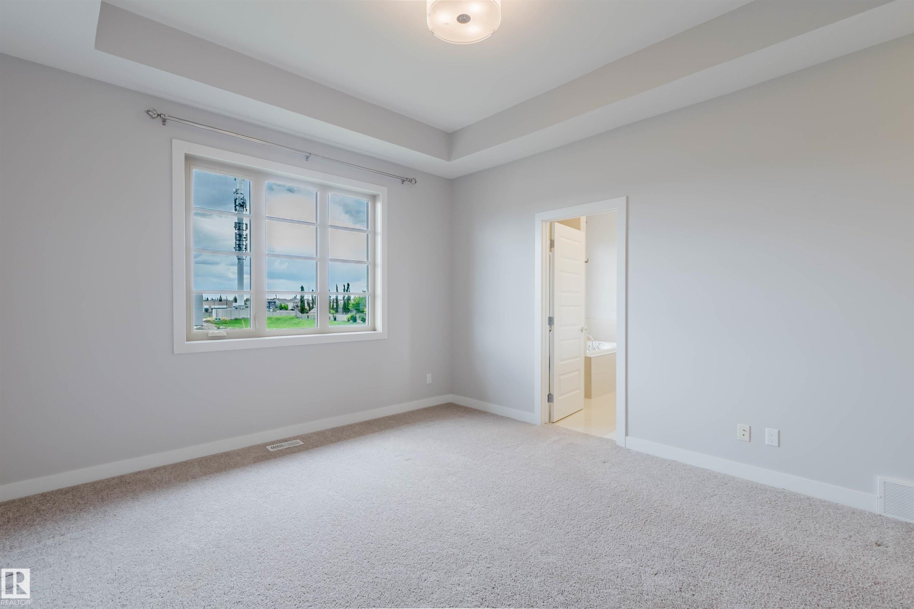 Neutral-toned carpeting throughout - 2921 Anderson Crest Sw, Edmonton, AB - Indoor Photo Showing Other Room