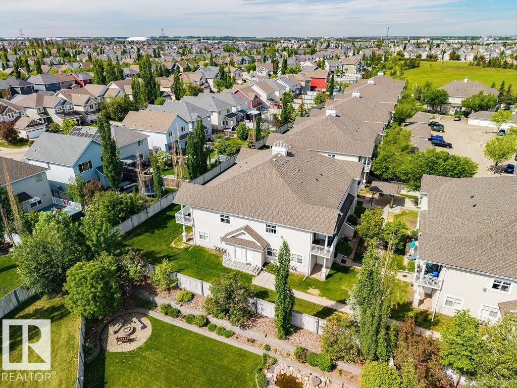 Aerial perspective showcasing a residential community with varied architectural styles - 71 3040 Spence Wynd, Edmonton, AB