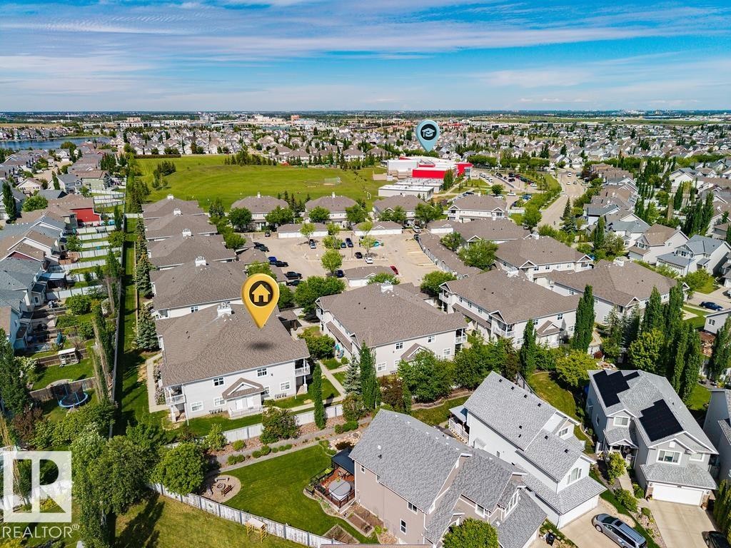 Aerial perspective showcasing a residential community with abundant green spaces - 71 3040 Spence Wynd, Edmonton, AB