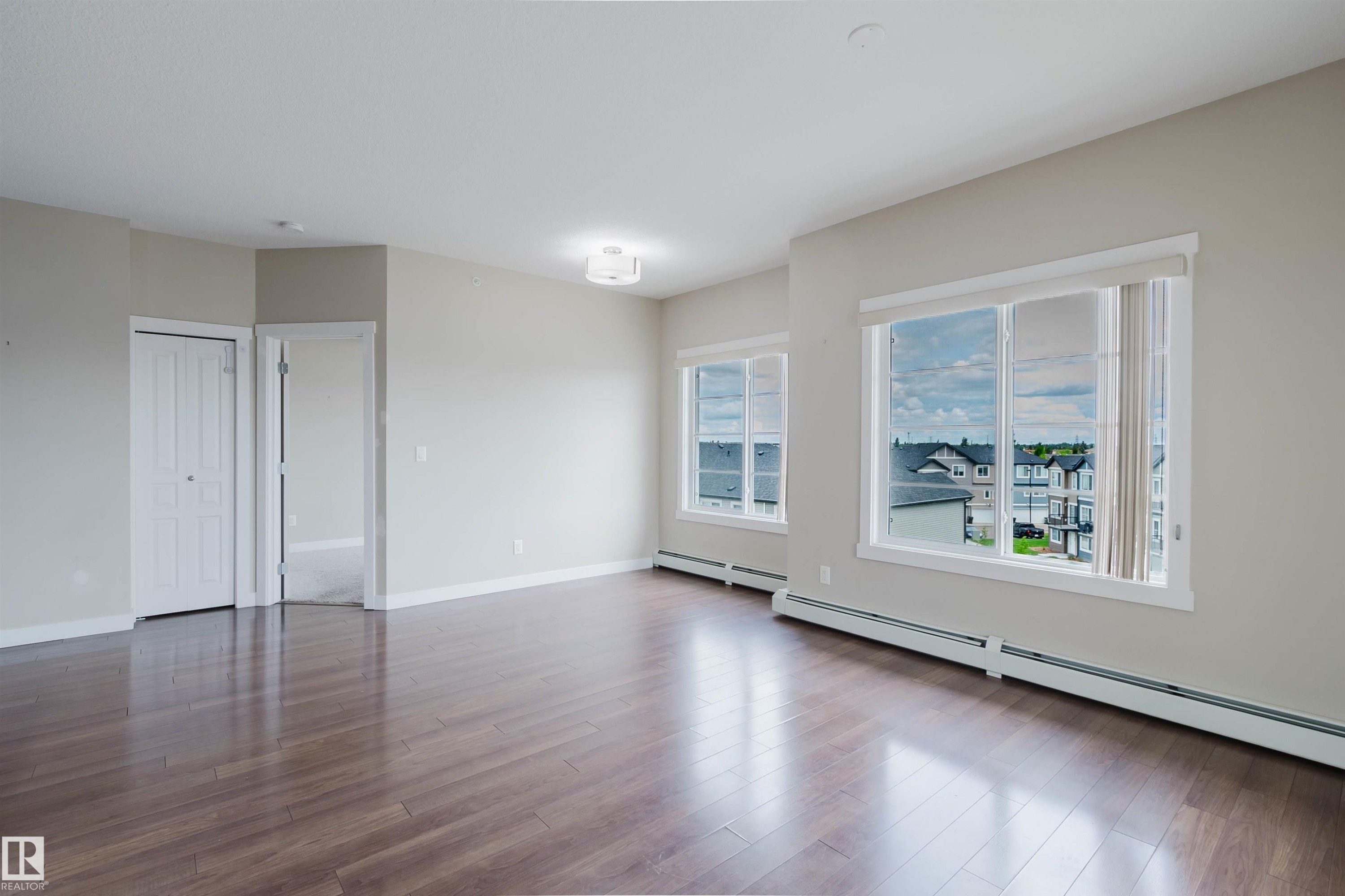 Spacious interior with rich wood-finish flooring - 402 3670 139 Avenue, Edmonton, AB