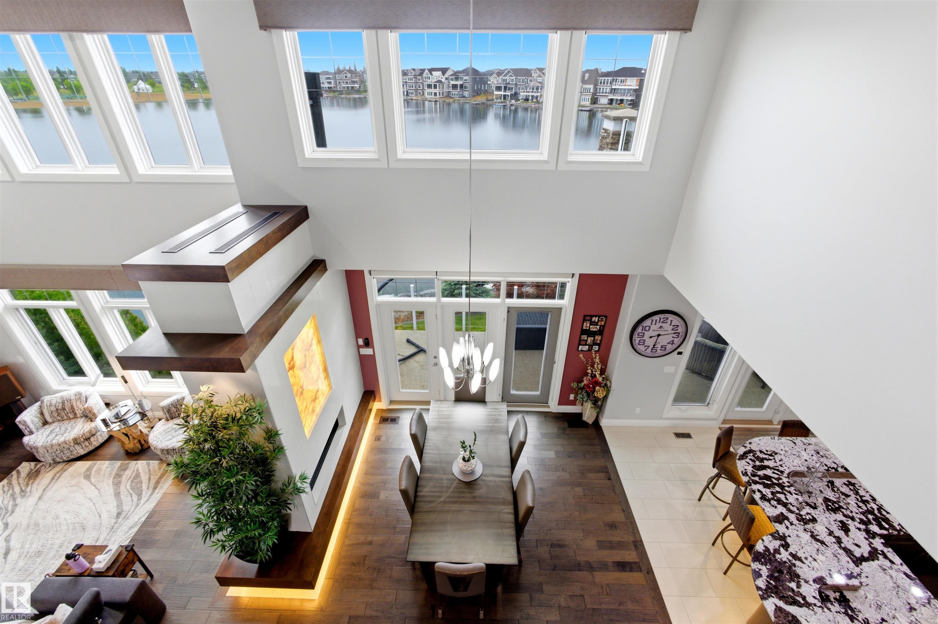 Two-story living area with abundant natural light from multiple windows - 9003 16 Avenue Sw, Edmonton, AB - Indoor Photo Showing Other Room