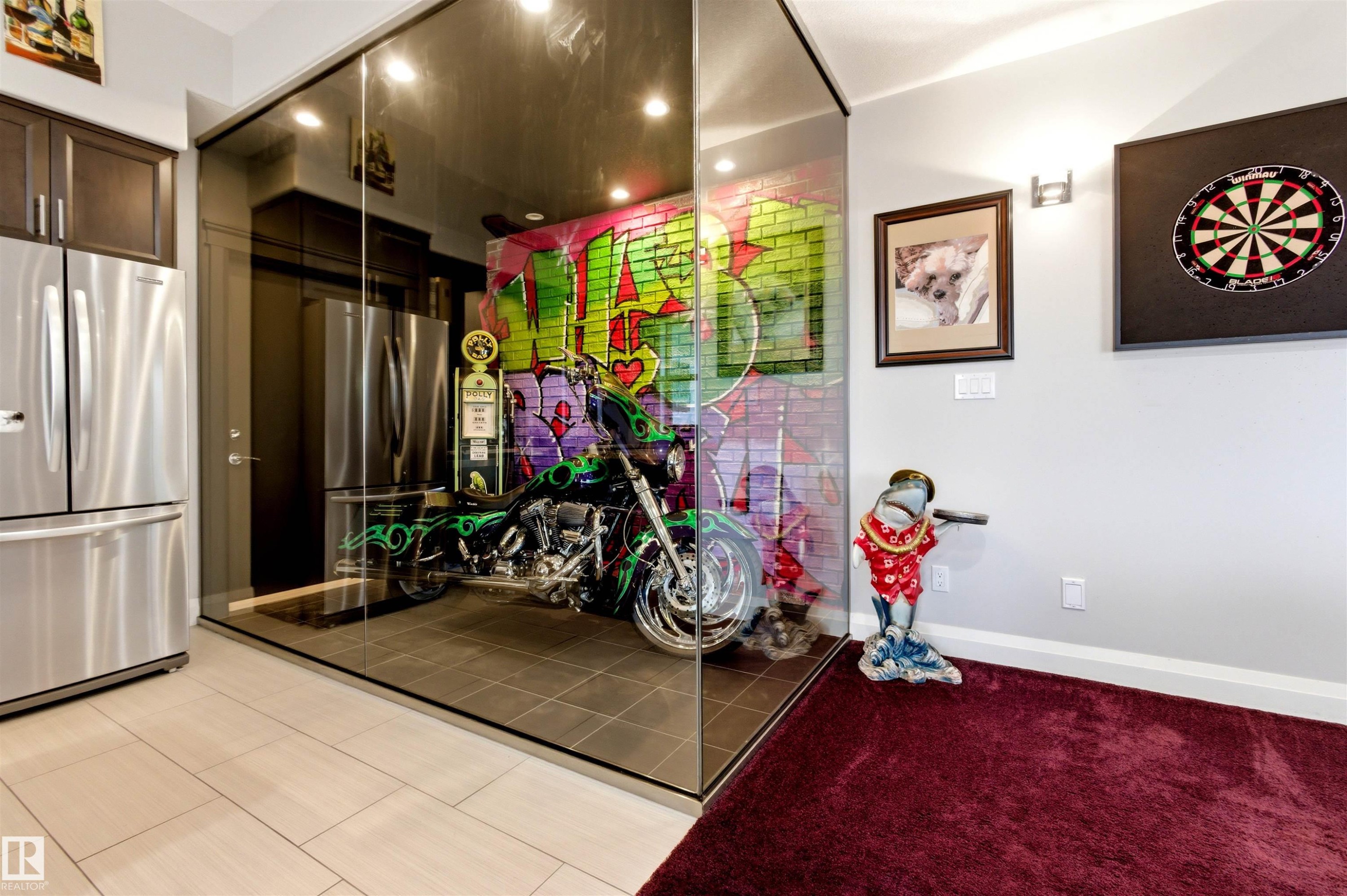 Glass-enclosed showroom featuring a dark tile floor and vibrant wall art - 9003 16 Avenue Sw, Edmonton, AB - Indoor