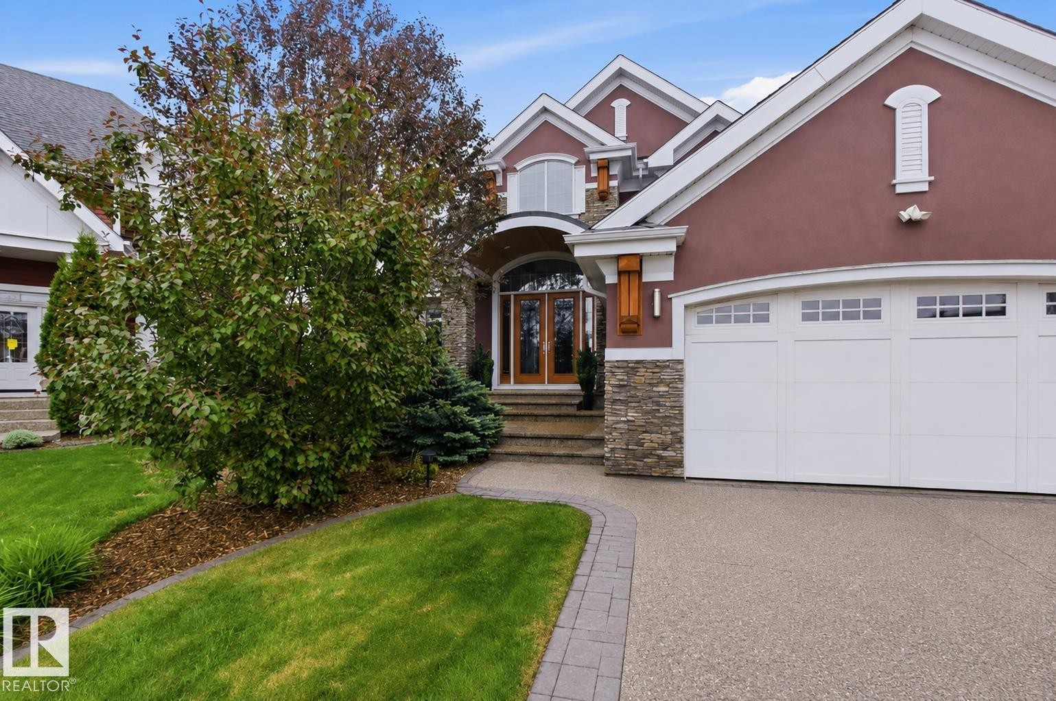 Stucco exterior with stone accents and white trim - 9003 16 Avenue Sw, Edmonton, AB - Outdoor With Facade