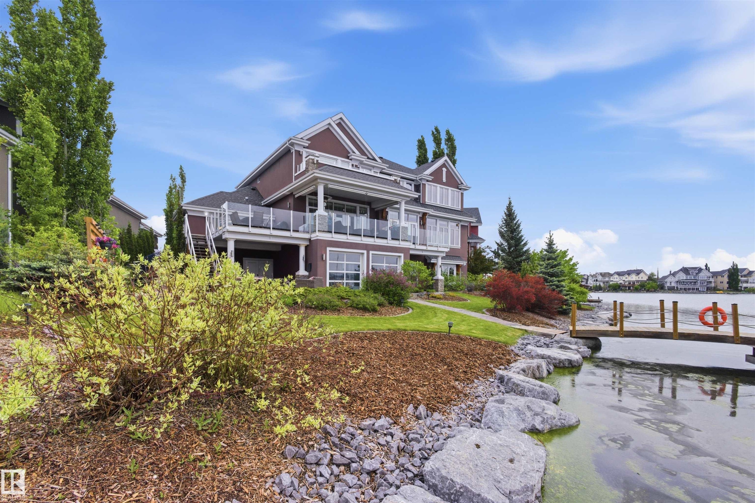 Multi-level residence featuring a lakeside setting with a private wooden dock - 9003 16 Avenue Sw, Edmonton, AB - Outdoor With Balcony With Deck Patio Veranda