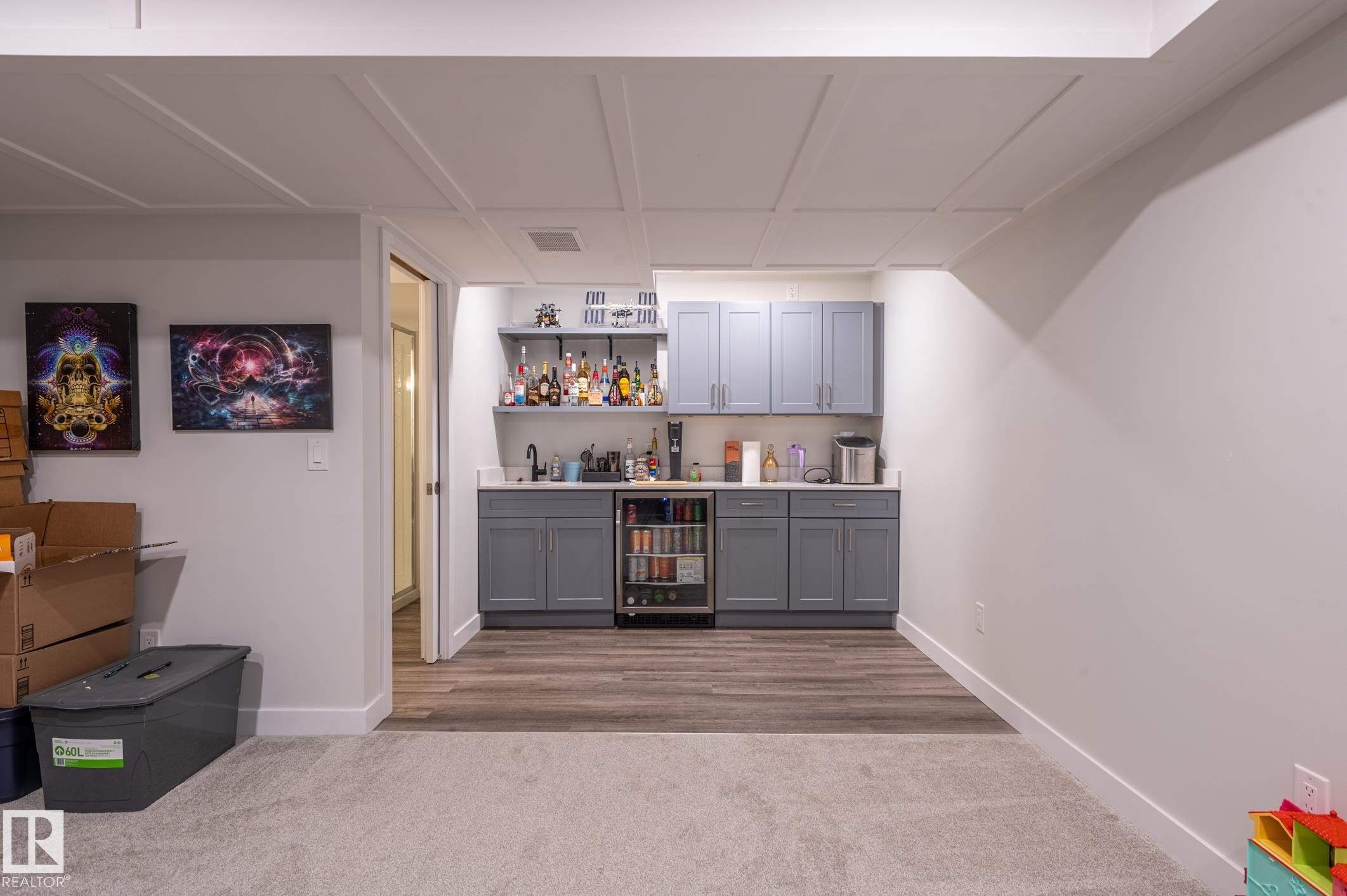 Wet bar featuring gray cabinetry, a beverage refrigerator, and open shelving - 17562 63A Street, Edmonton, AB