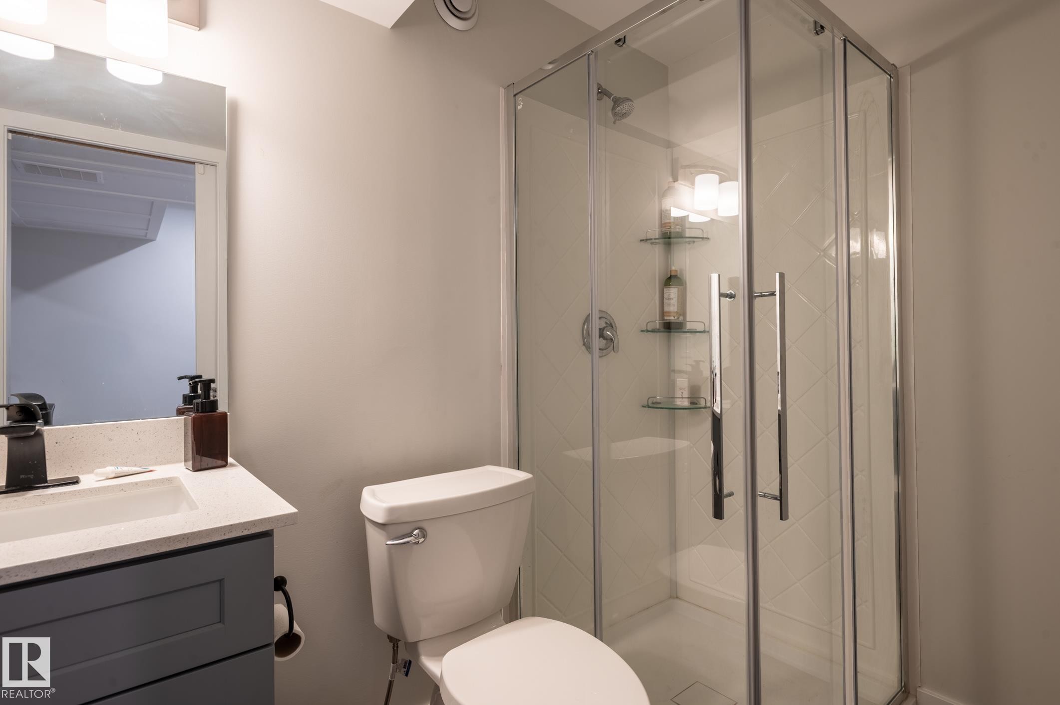 Corner glass shower enclosure with chrome hardware - 17562 63A Street, Edmonton, AB