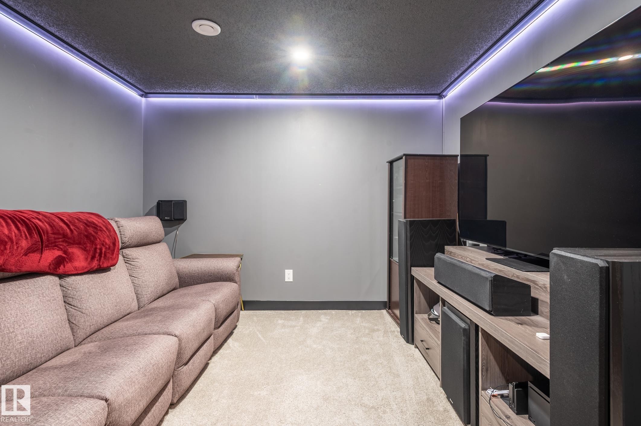 Media room featuring a dark ceiling, recessed lighting, and perimeter cove lighting - 17562 63A Street, Edmonton, AB