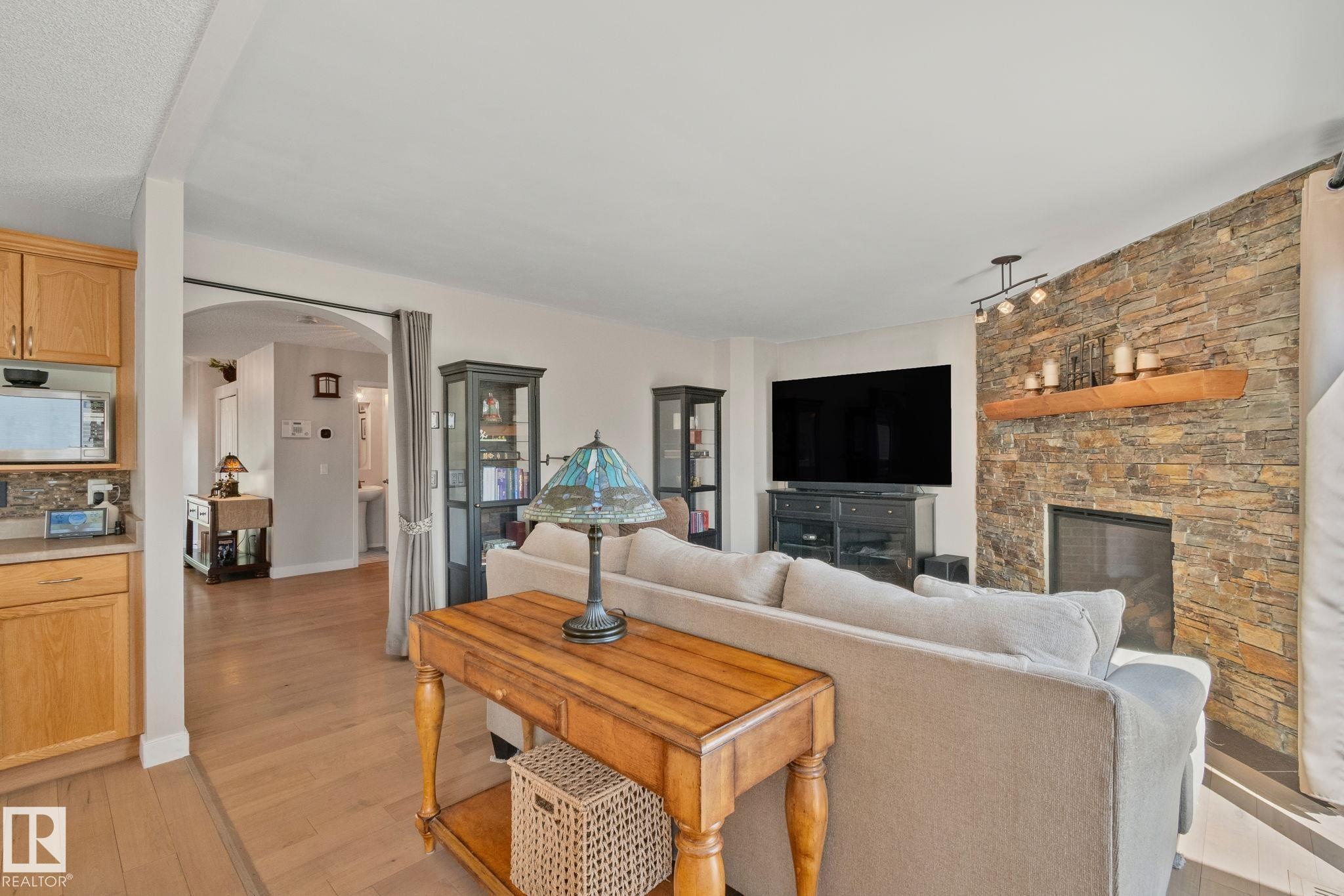 591 Byrne Crescent Sw, Edmonton, AB - Indoor Photo Showing Living Room With Fireplace