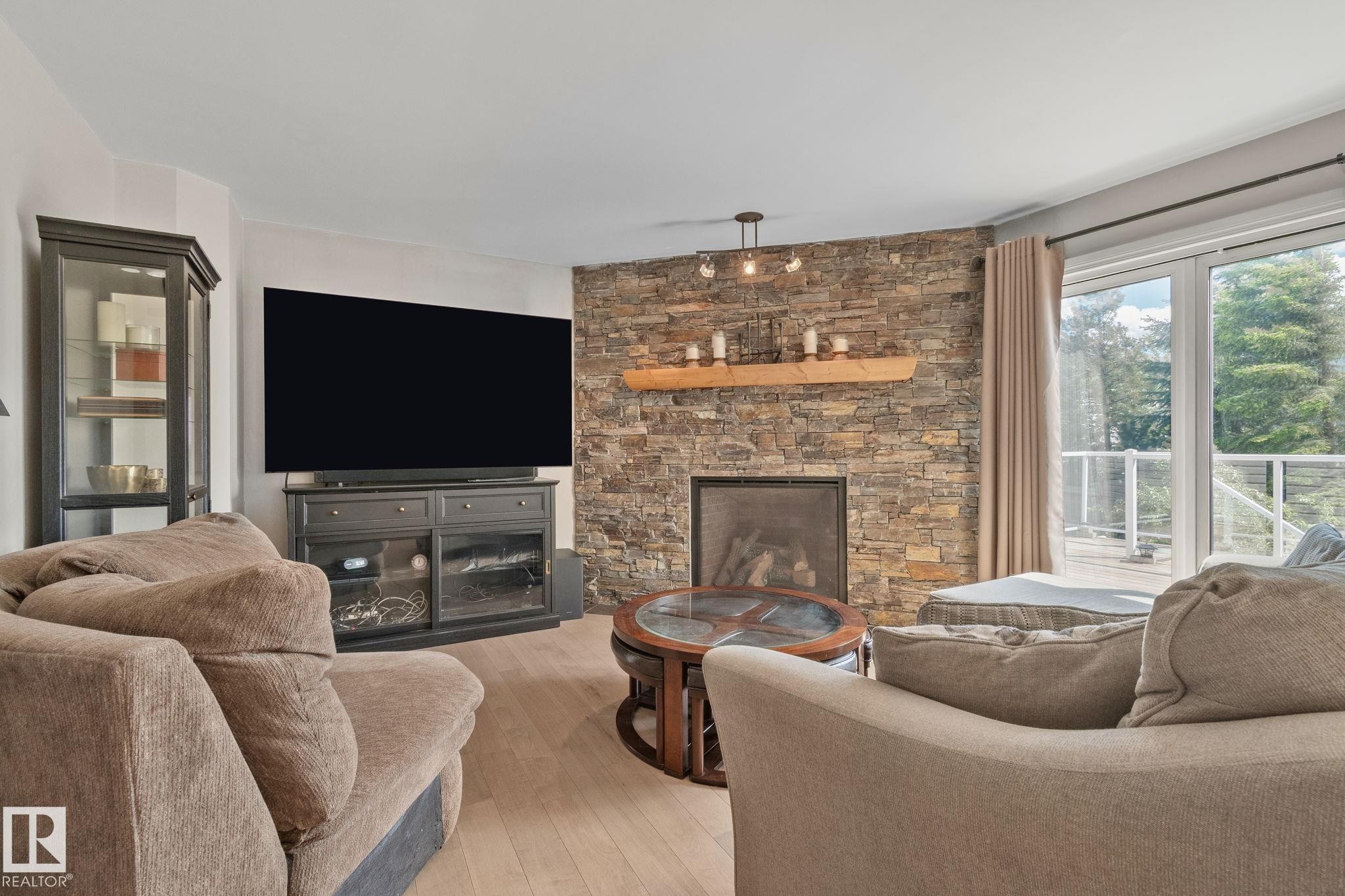 591 Byrne Crescent Sw, Edmonton, AB - Indoor Photo Showing Living Room With Fireplace