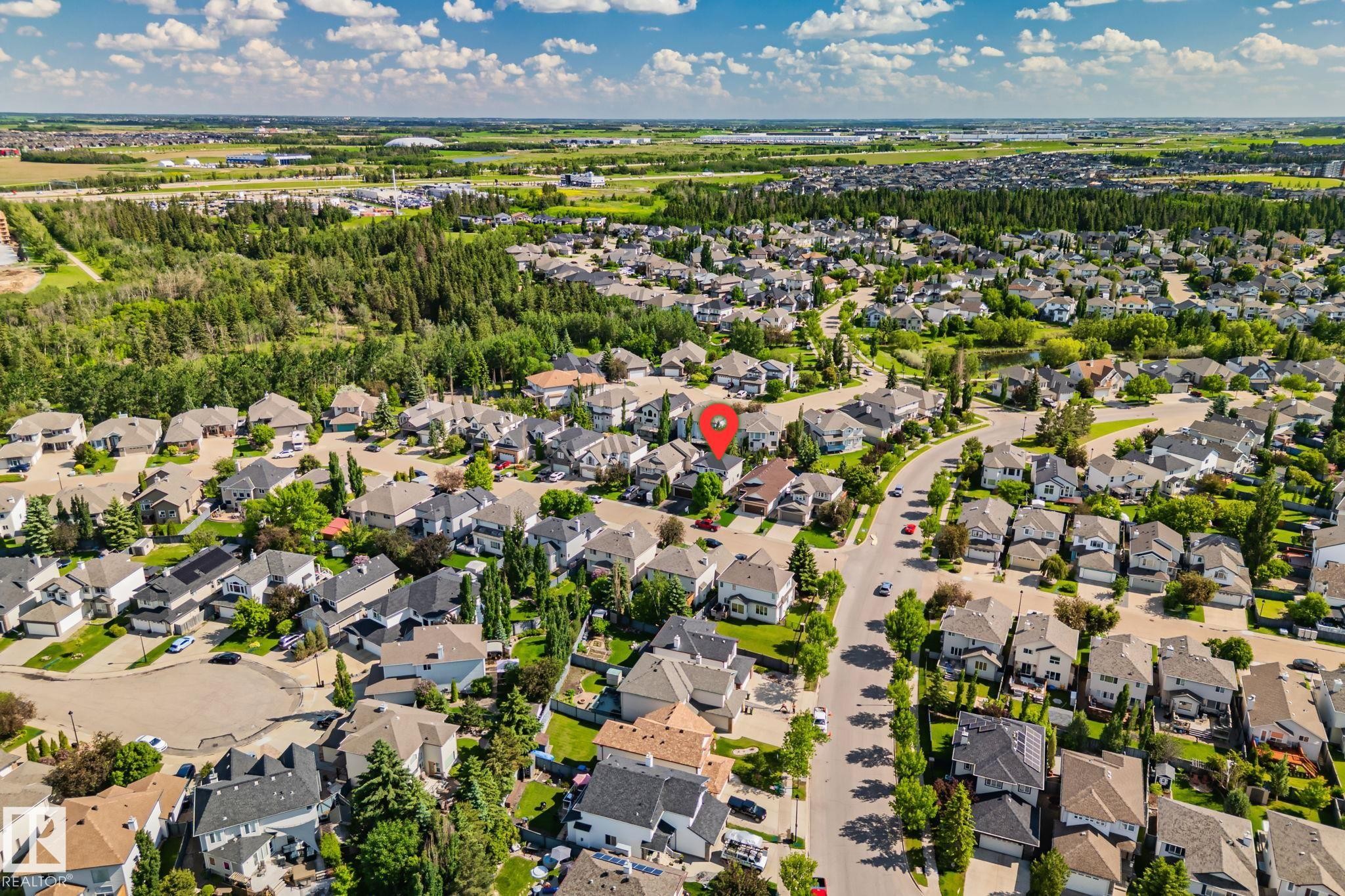 Residential community featuring diverse home styles and mature landscaping - 591 Byrne Crescent Sw, Edmonton, AB - Outdoor With View