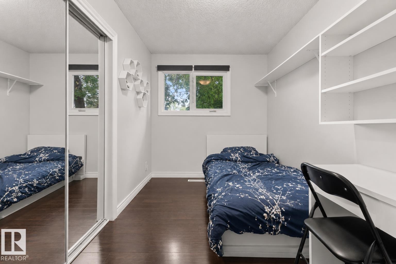 Room featuring dark wood-finish flooring and light gray walls - 11234 40 Avenue Nw, Edmonton, AB - Indoor Photo Showing Bedroom