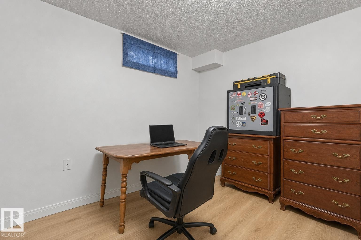 White walls and wood-finish flooring provide a neutral aesthetic - 11234 40 Avenue Nw, Edmonton, AB - Indoor Photo Showing Office