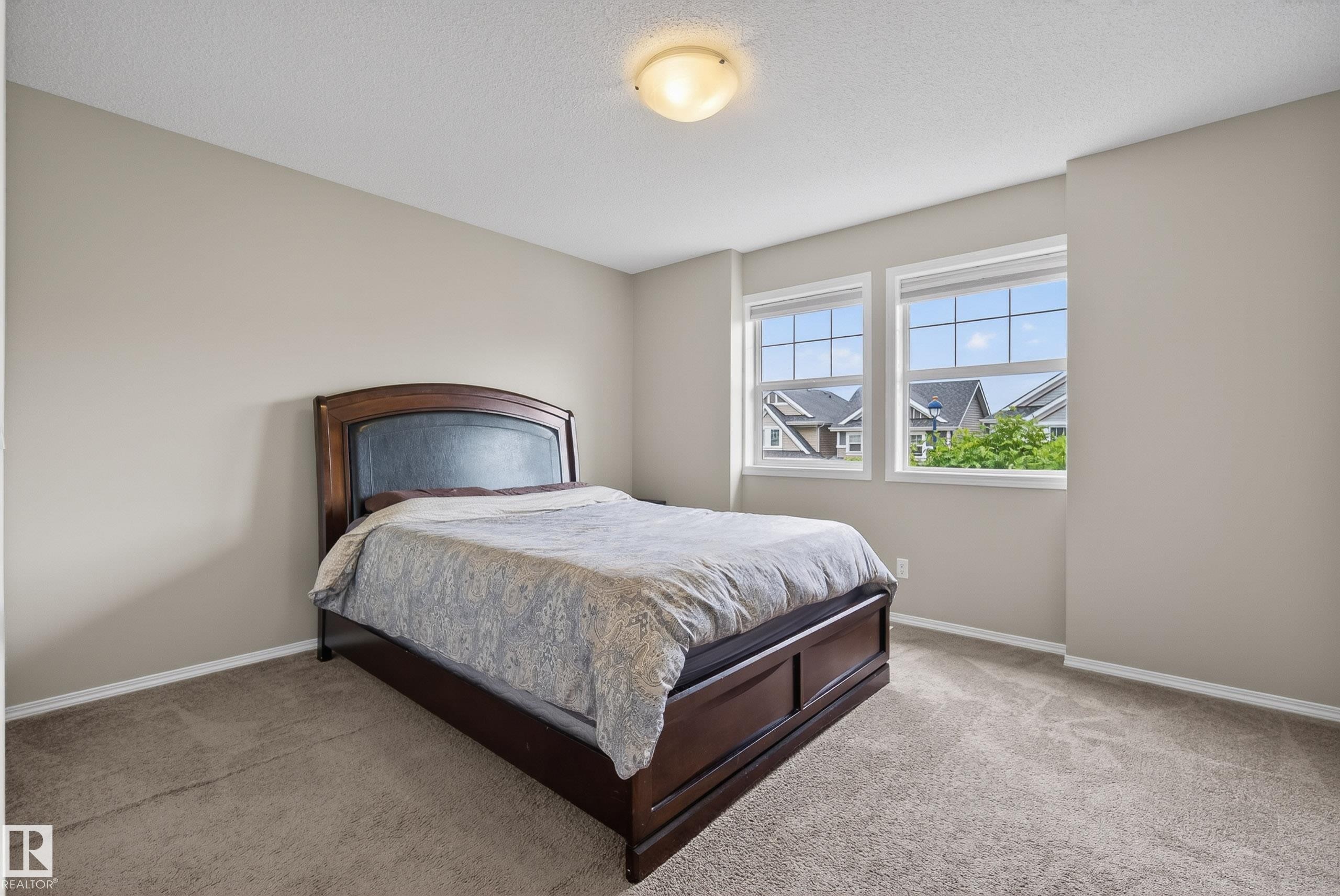 Carpeted room with neutral wall tones - 2325 69A Street, Edmonton, AB