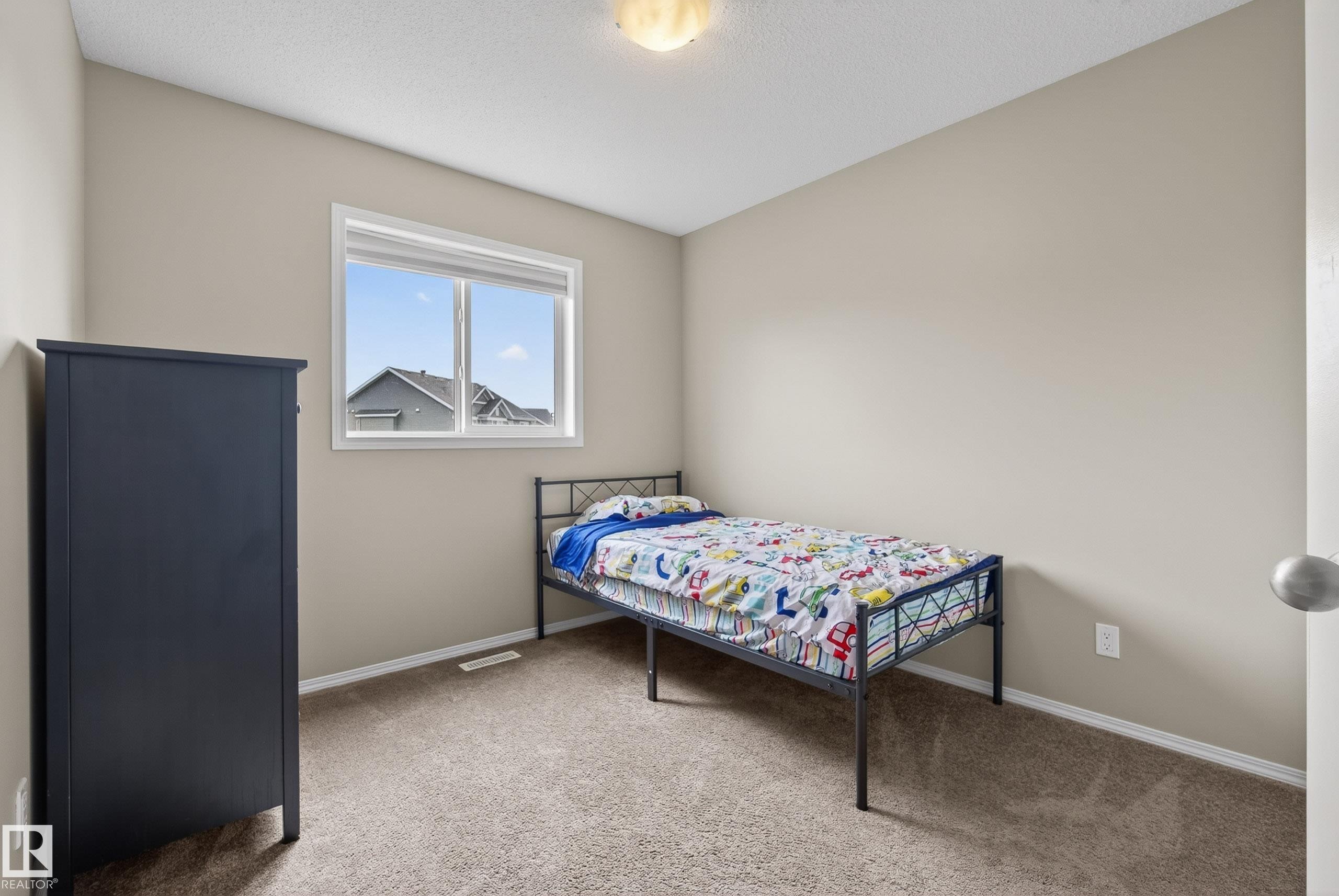 Neutral-toned walls complement plush carpeting - 2325 69A Street, Edmonton, AB