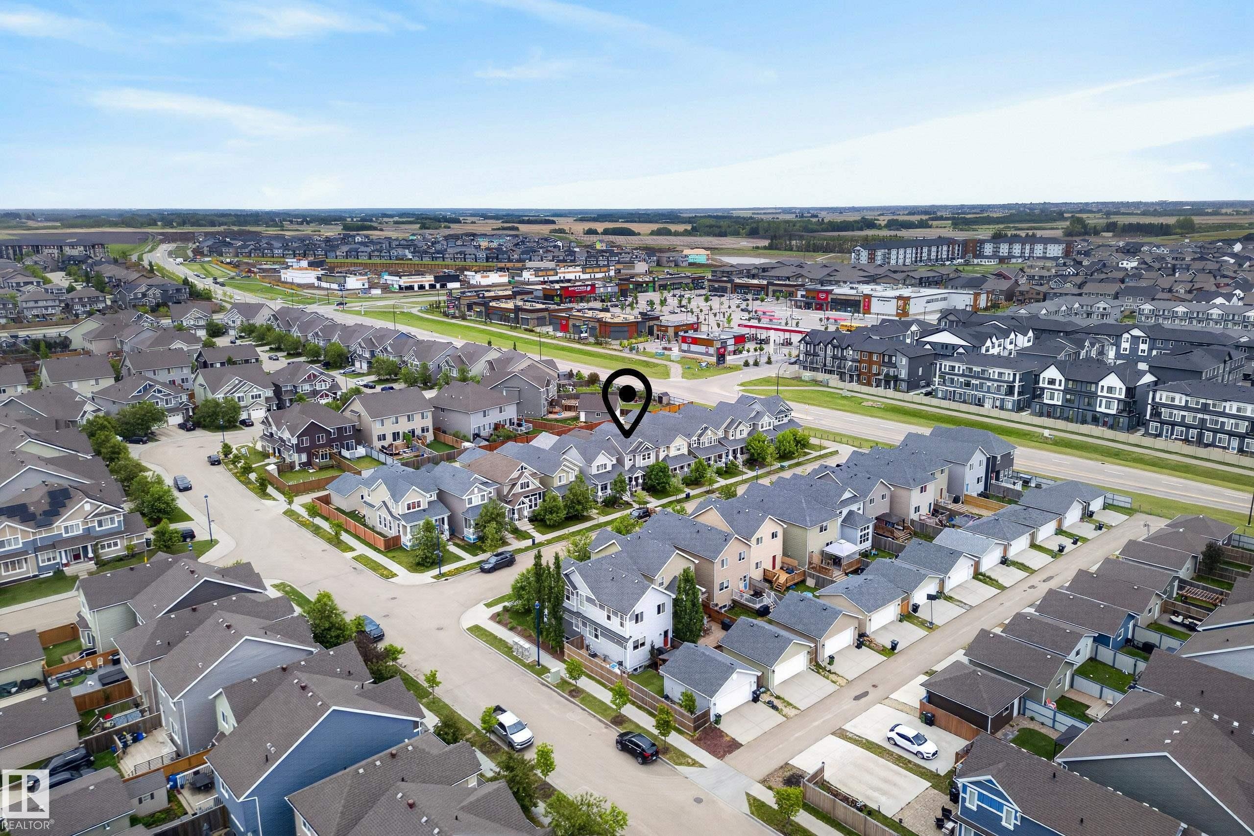 Residential neighborhood with diverse housing styles, including single-family homes and multi-story buildings - 2325 69A Street, Edmonton, AB