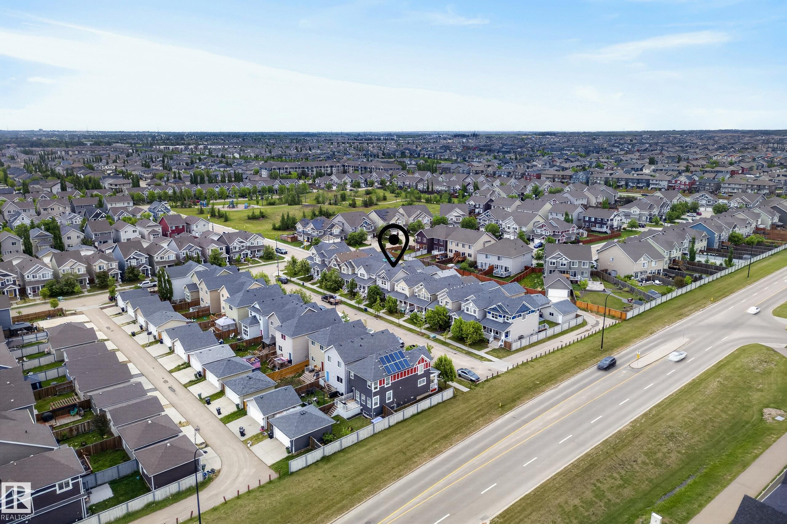 Aerial perspective showcasing a residential community with numerous single-family homes - 2325 69A Street, Edmonton, AB