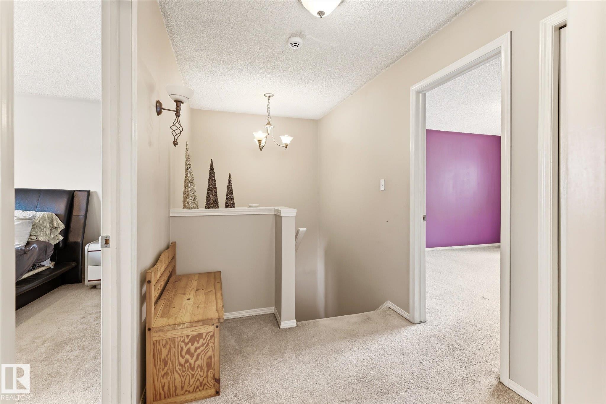 Upper-level hallway featuring neutral wall paint, light-colored carpeting, and white trim - #37 4020 21 St Nw, Edmonton, AB - Indoor Photo Showing Other Room