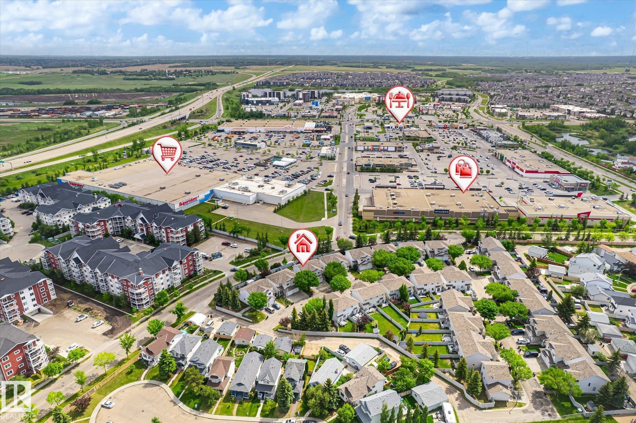 Aerial perspective showcasing residential properties and commercial developments - #37 4020 21 St Nw, Edmonton, AB - Outdoor With View
