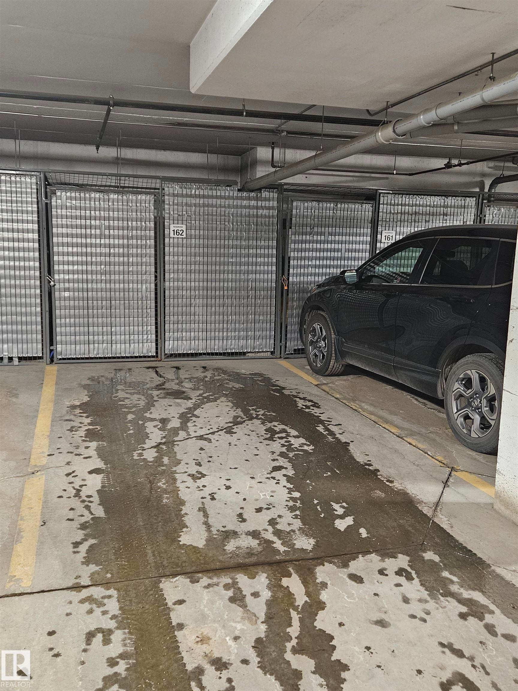 Image quality insufficient for description - 439 300 Palisades Way, Sherwood Park, AB - Indoor Photo Showing Garage