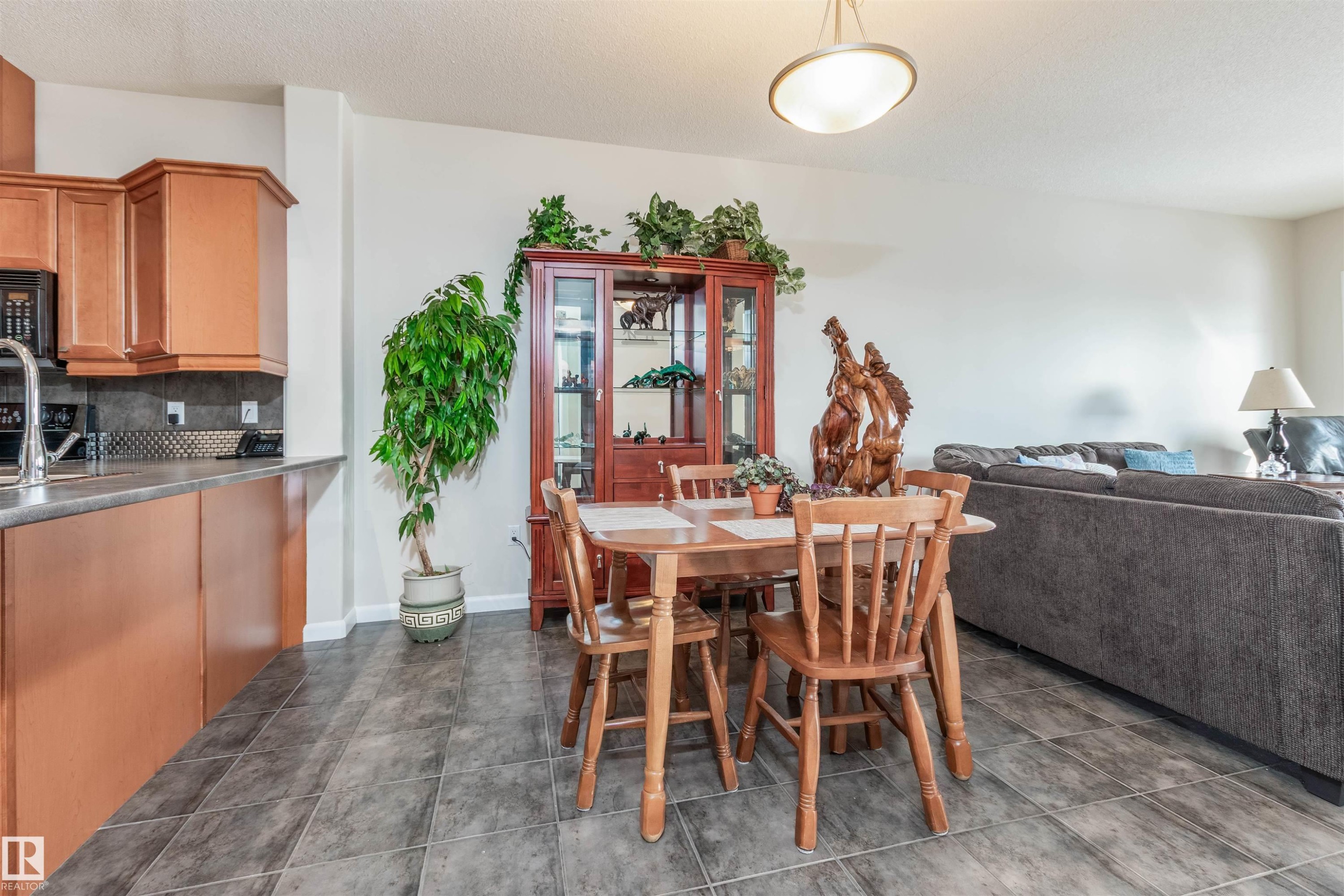 Open-concept living area with gray tile flooring - 439 300 Palisades Way, Sherwood Park, AB - Indoor Photo Showing Other Room