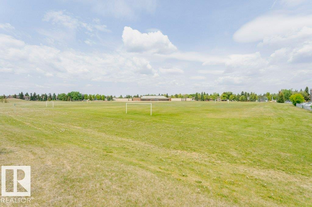 Expansive green space featuring large grassy areas - 71 11255 31 Avenue, Edmonton, AB - Outdoor With View