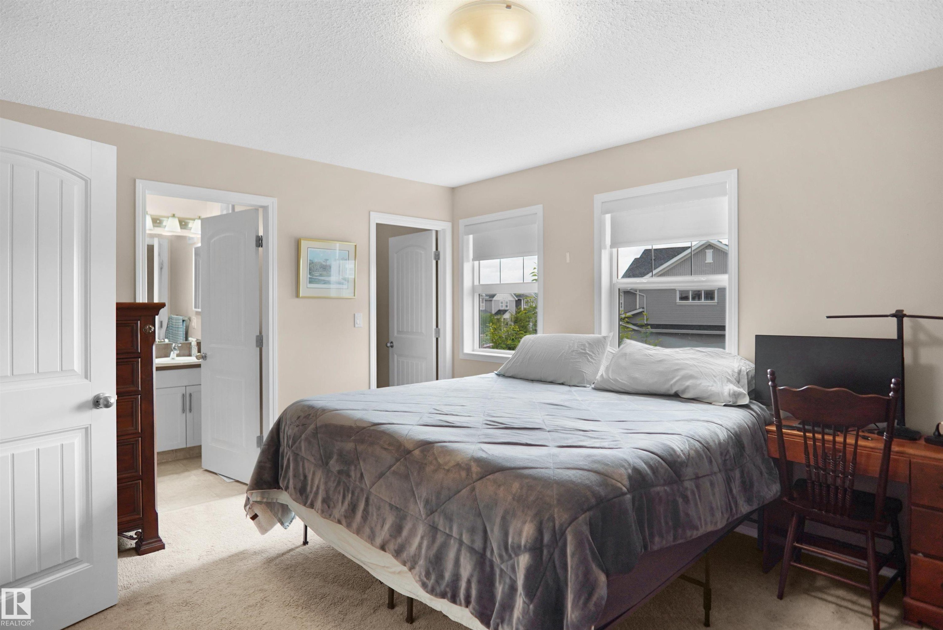 Carpeted room with a ceiling-mounted light fixture - 292 Simmonds Way, Leduc, AB