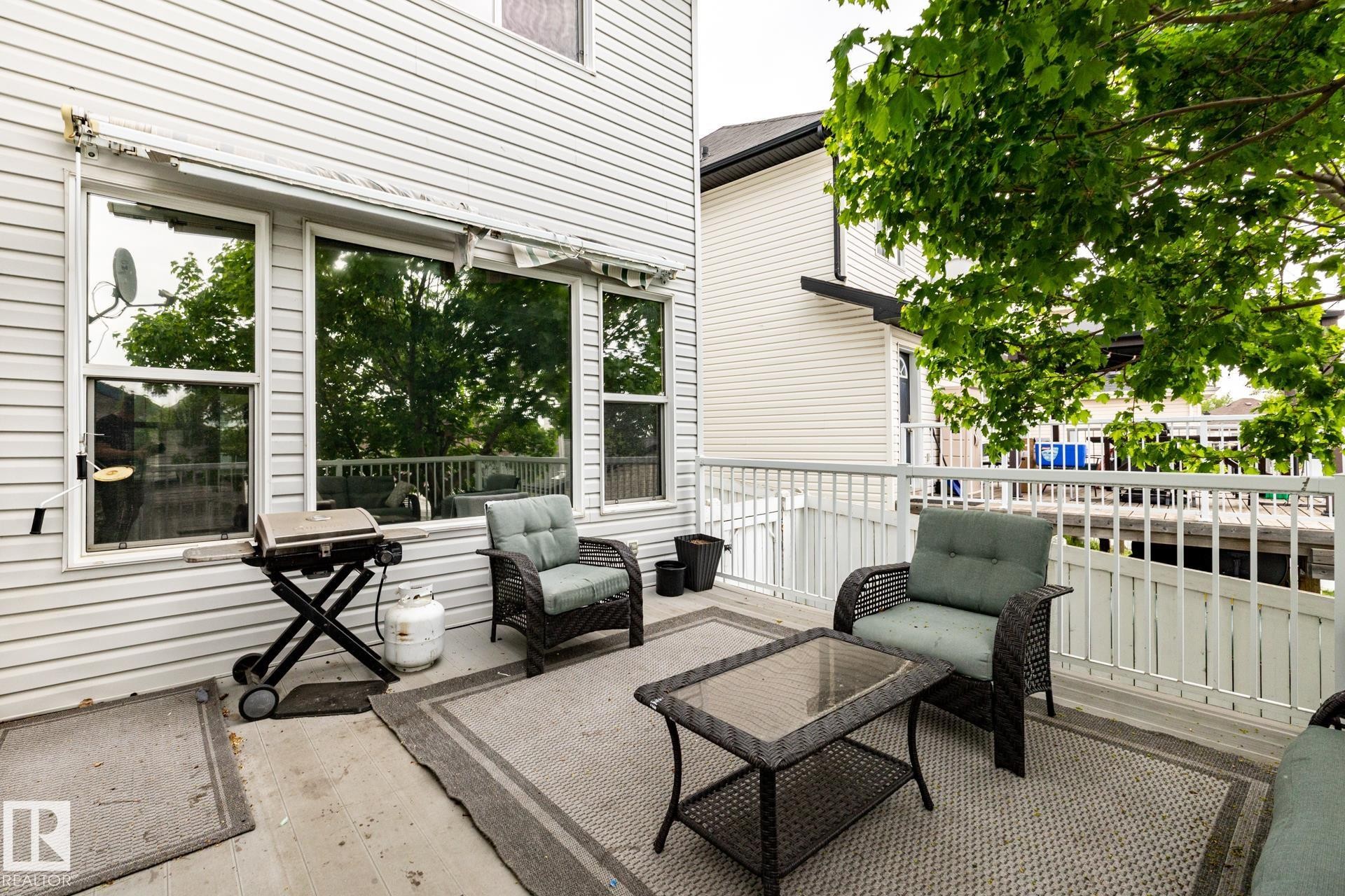 Outdoor patio space featuring a concrete surface and white railings - 2036 Towne Centre Boulevard, Edmonton, AB - Outdoor With Deck Patio Veranda With Exterior