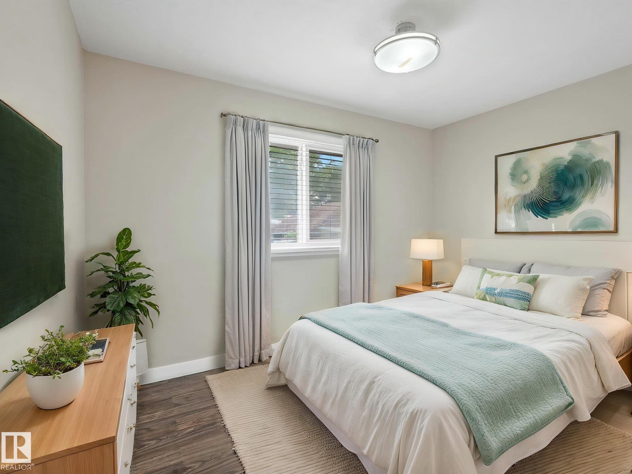 Bedroom featuring wood-finish flooring, a contemporary ceiling light fixture, and a window with blinds - 12241 54 Street Nw, Edmonton, AB - Indoor Photo Showing Bedroom