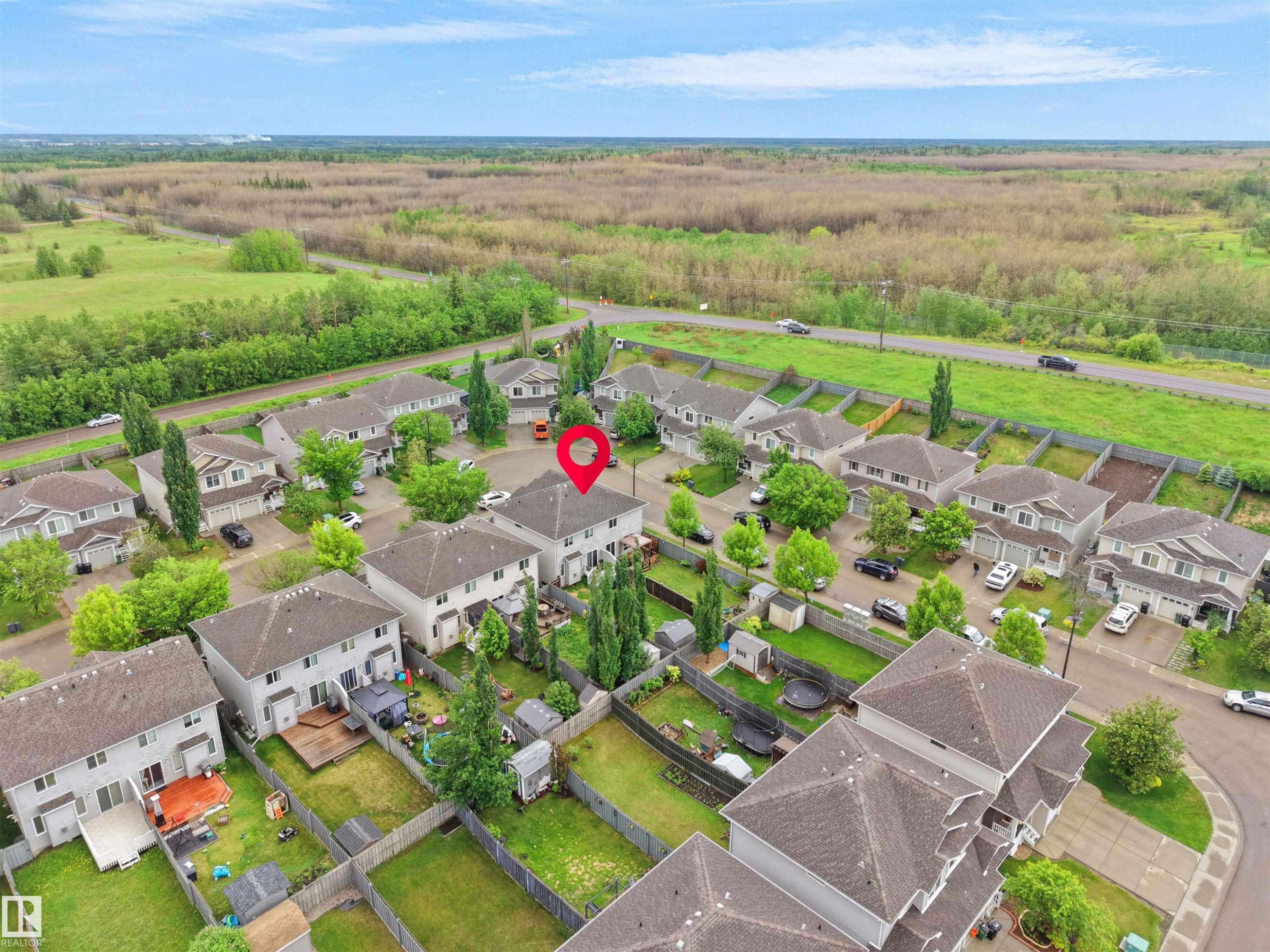 Aerial perspective of a residential community featuring multiple homes with gray shingle roofs - 21316 45A Avenue Nw, Edmonton, AB