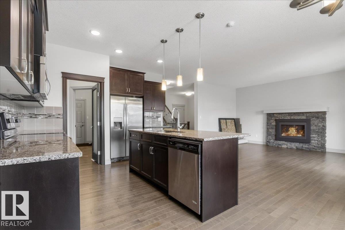 5912 19 Avenue Sw, Edmonton, AB - Indoor Photo Showing Other Room With Fireplace