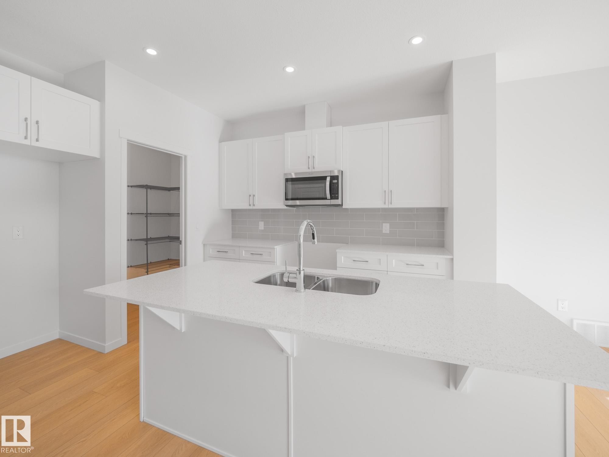 7408 Keeler Crescent Sw, Edmonton, AB - Indoor Photo Showing Kitchen With Double Sink