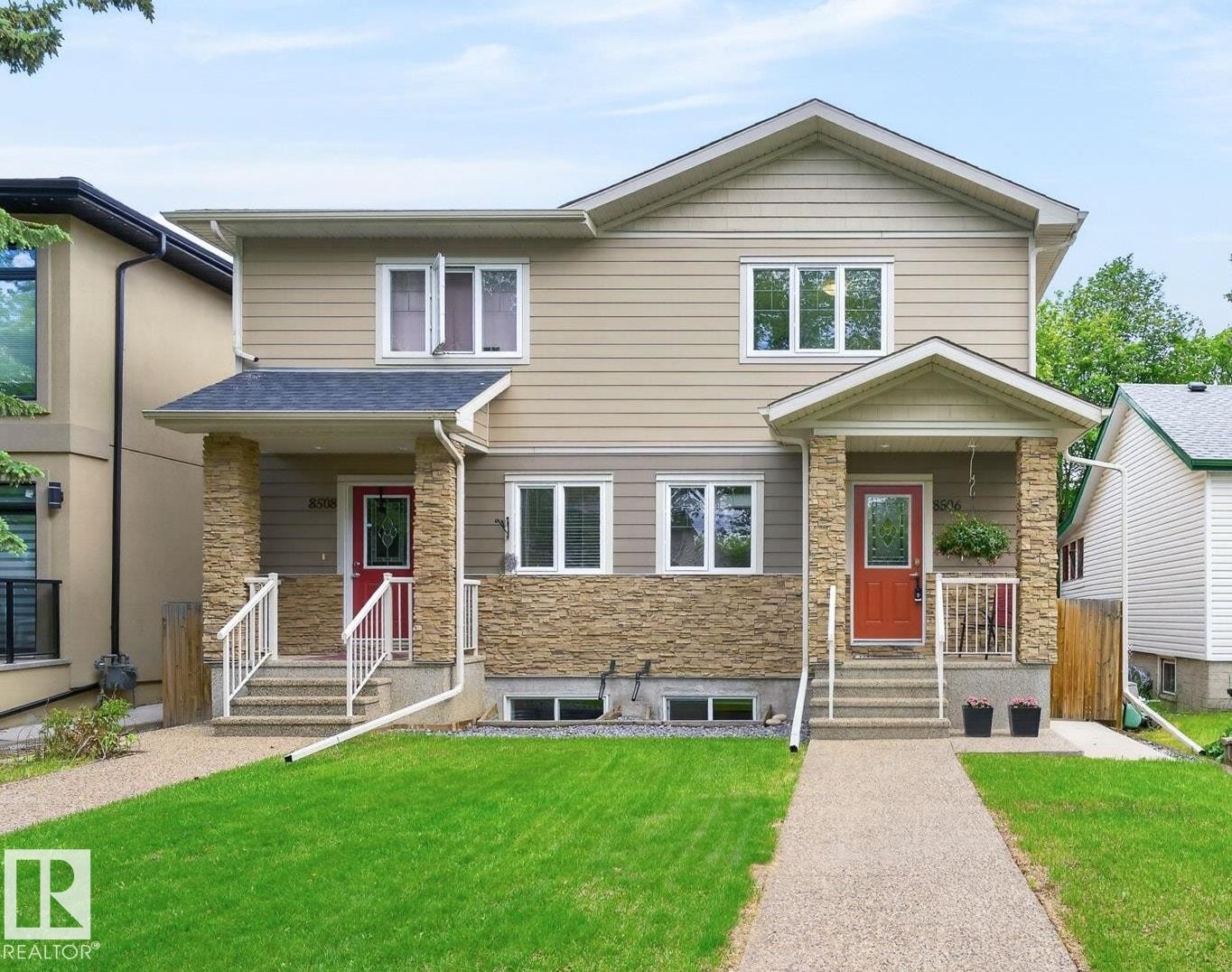 Two-story duplex with siding and stone accents - 8506 80 Avenue, Edmonton, AB