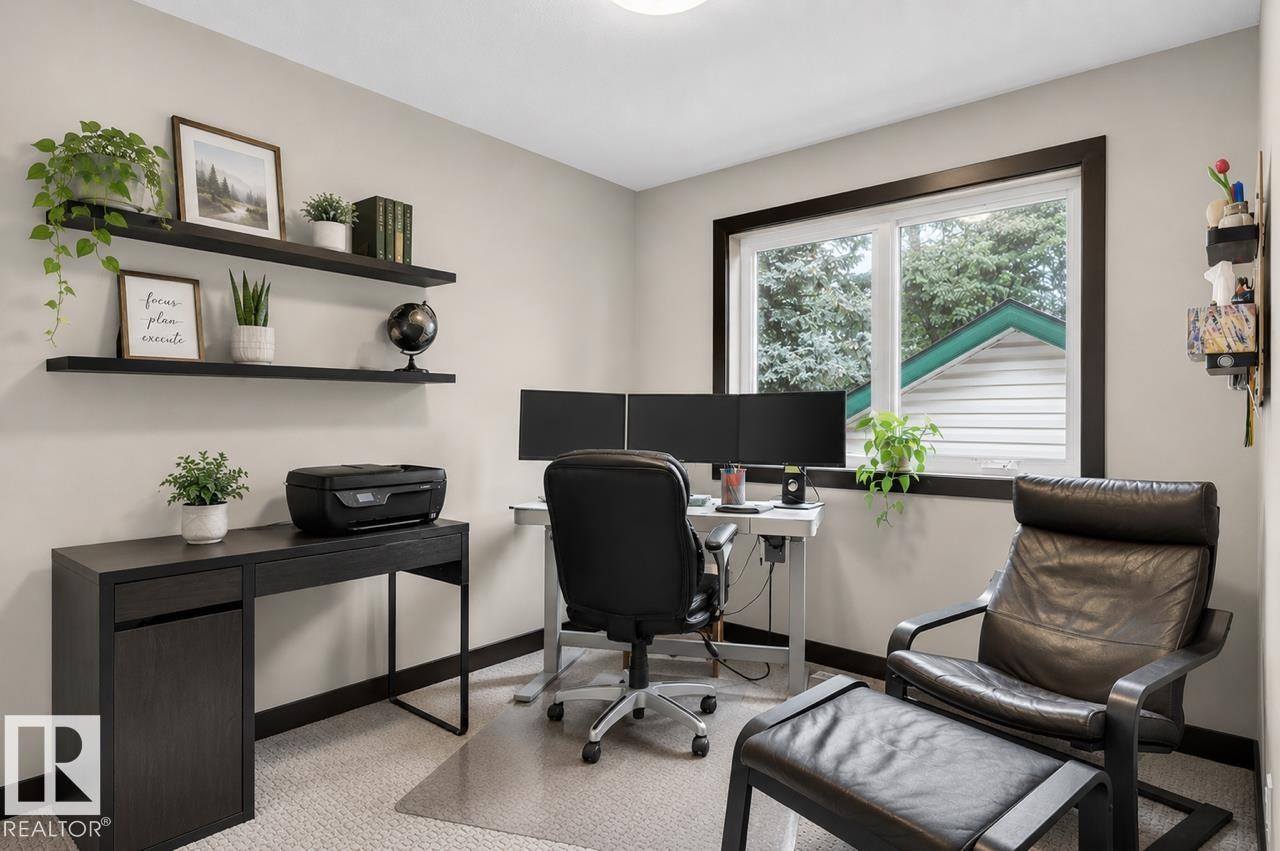 Dedicated room featuring light-toned walls, dark trim, and a window providing natural light - 8506 80 Avenue, Edmonton, AB