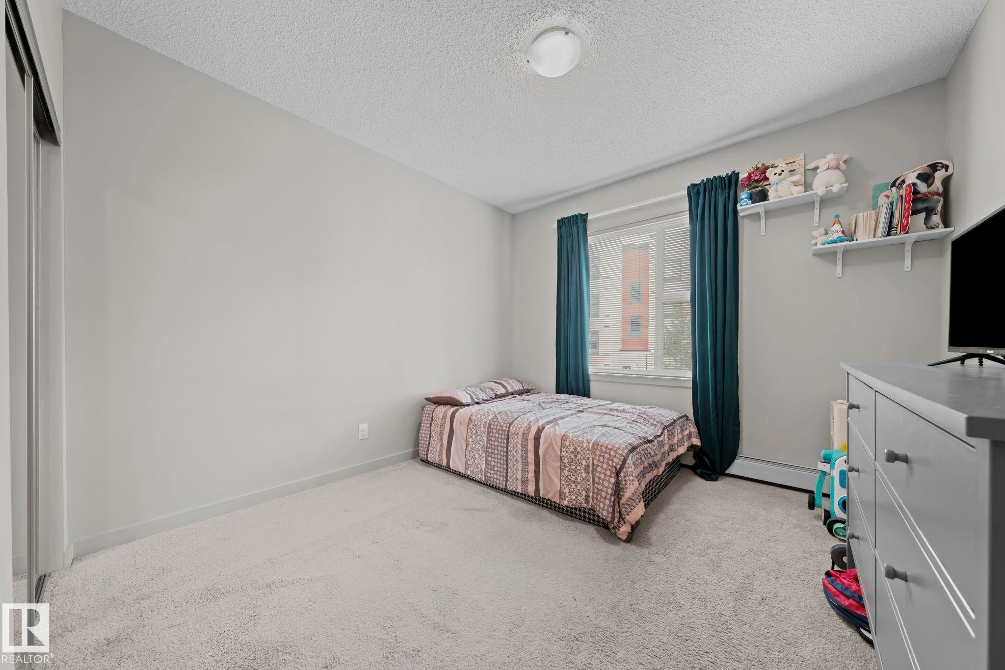 #207 320 Ambleside Li Sw, Edmonton, AB - Indoor Photo Showing Bedroom