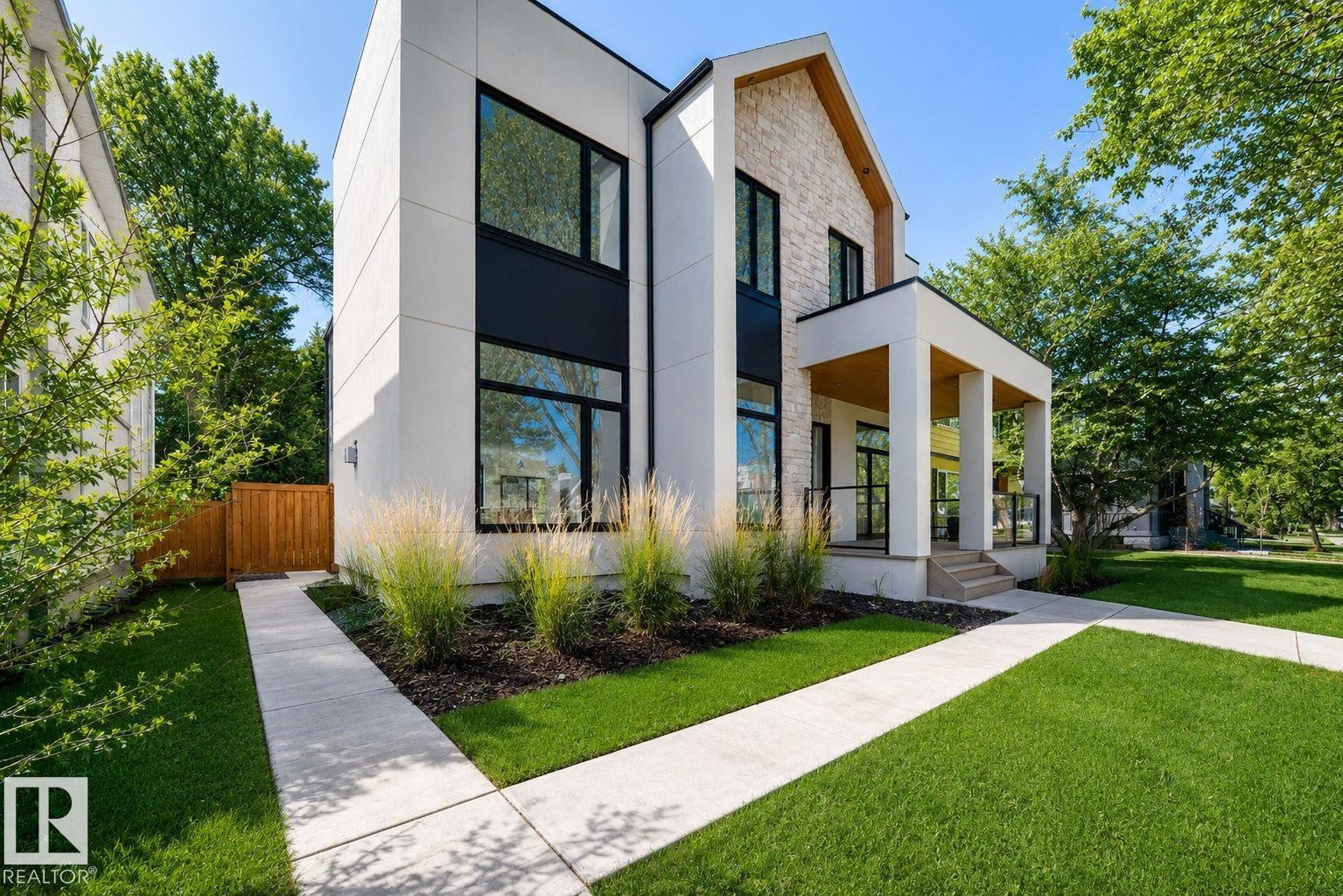 Contemporary exterior with clean lines, featuring a stone and stucco facade - 10514 134 Street, Edmonton, AB