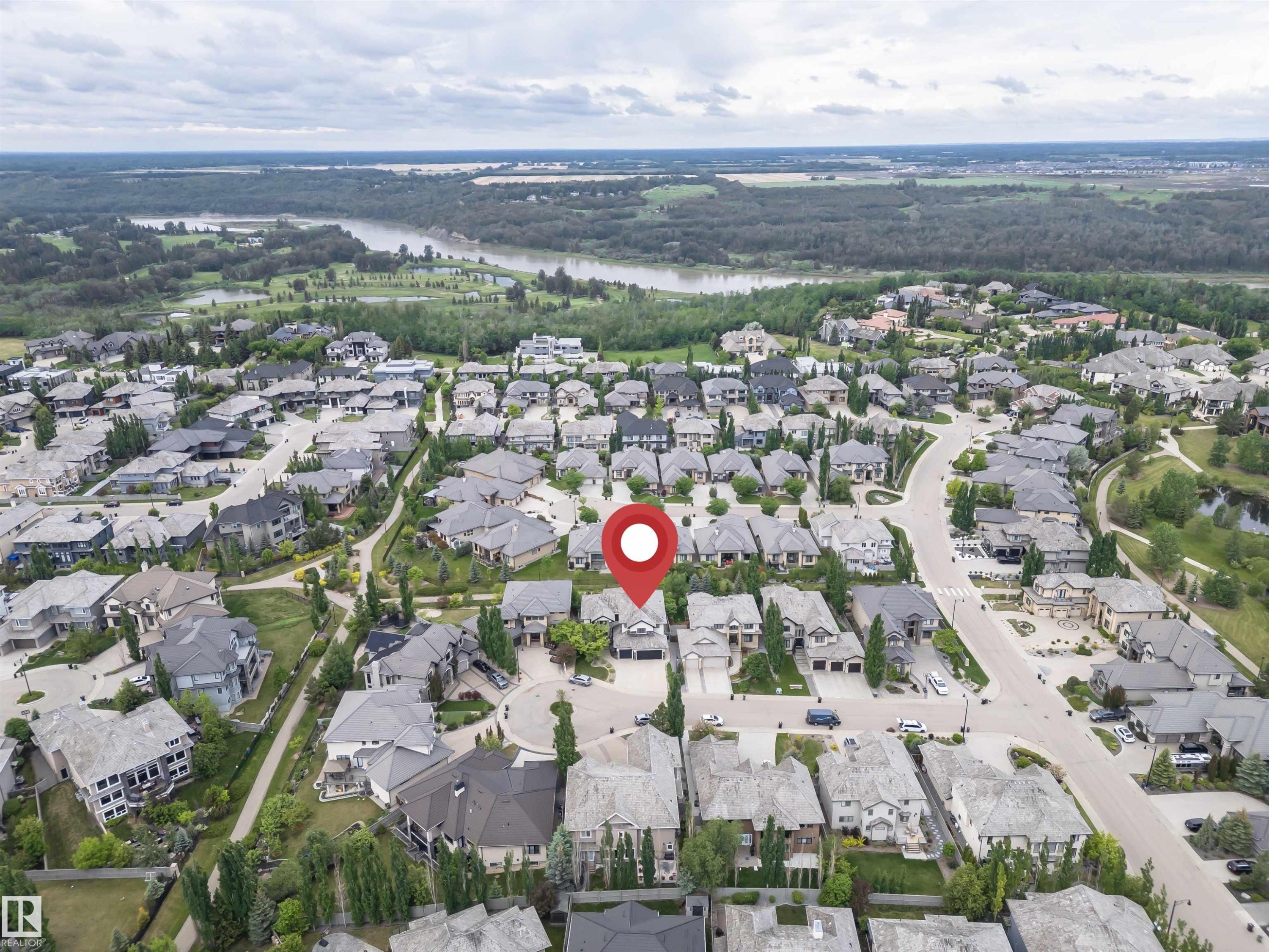Aerial perspective of a residential neighborhood featuring single-family homes and mature landscaping - 3310 Watson Bay, Edmonton, AB