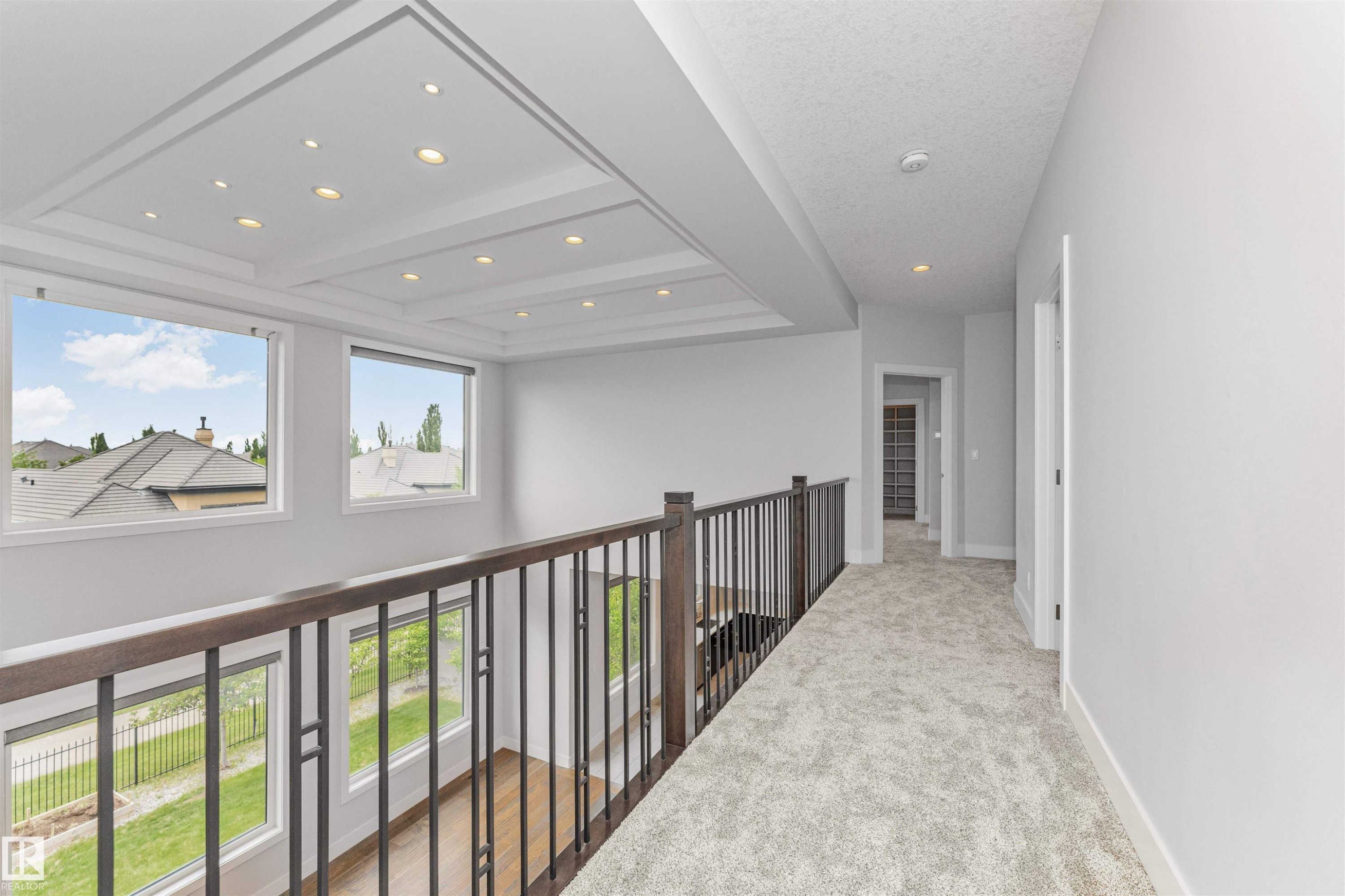 Upper-level landing featuring light-colored carpeting and white painted walls - 3310 Watson Bay, Edmonton, AB