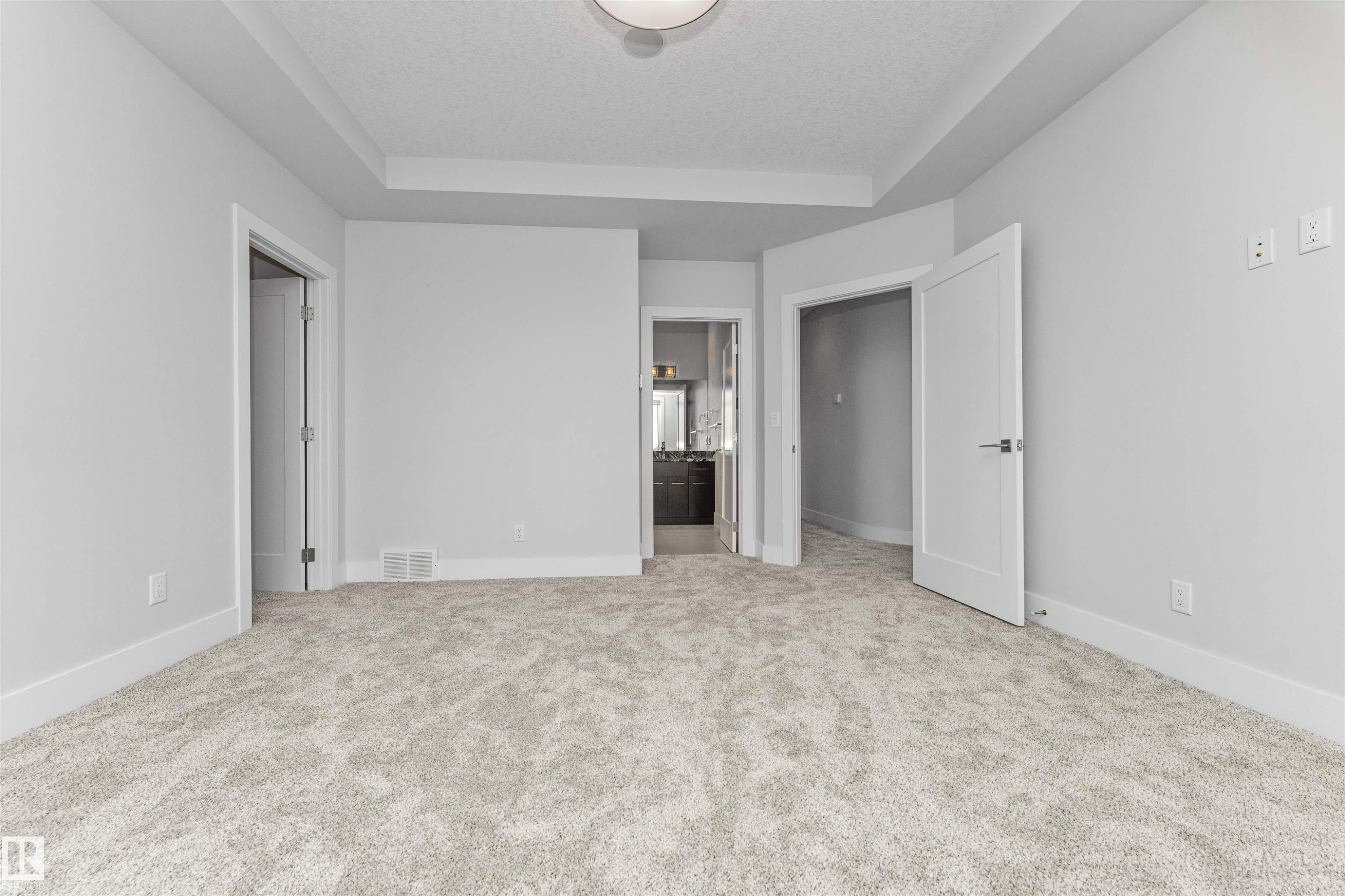 Neutral tone carpeting paired with white baseboards and light gray walls - 3310 Watson Bay, Edmonton, AB