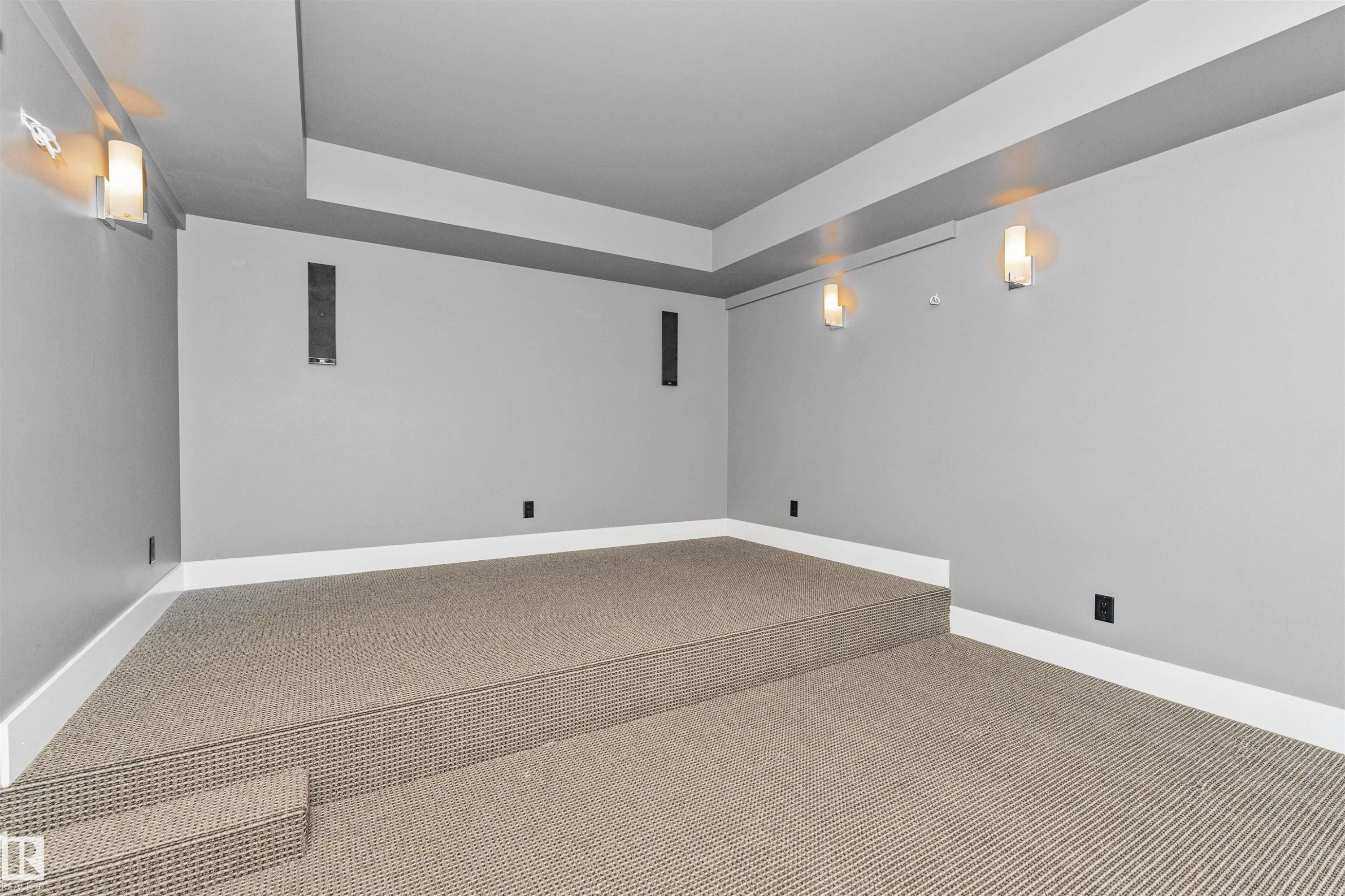 Tiered carpeted flooring with integrated sound system speakers - 3310 Watson Bay, Edmonton, AB