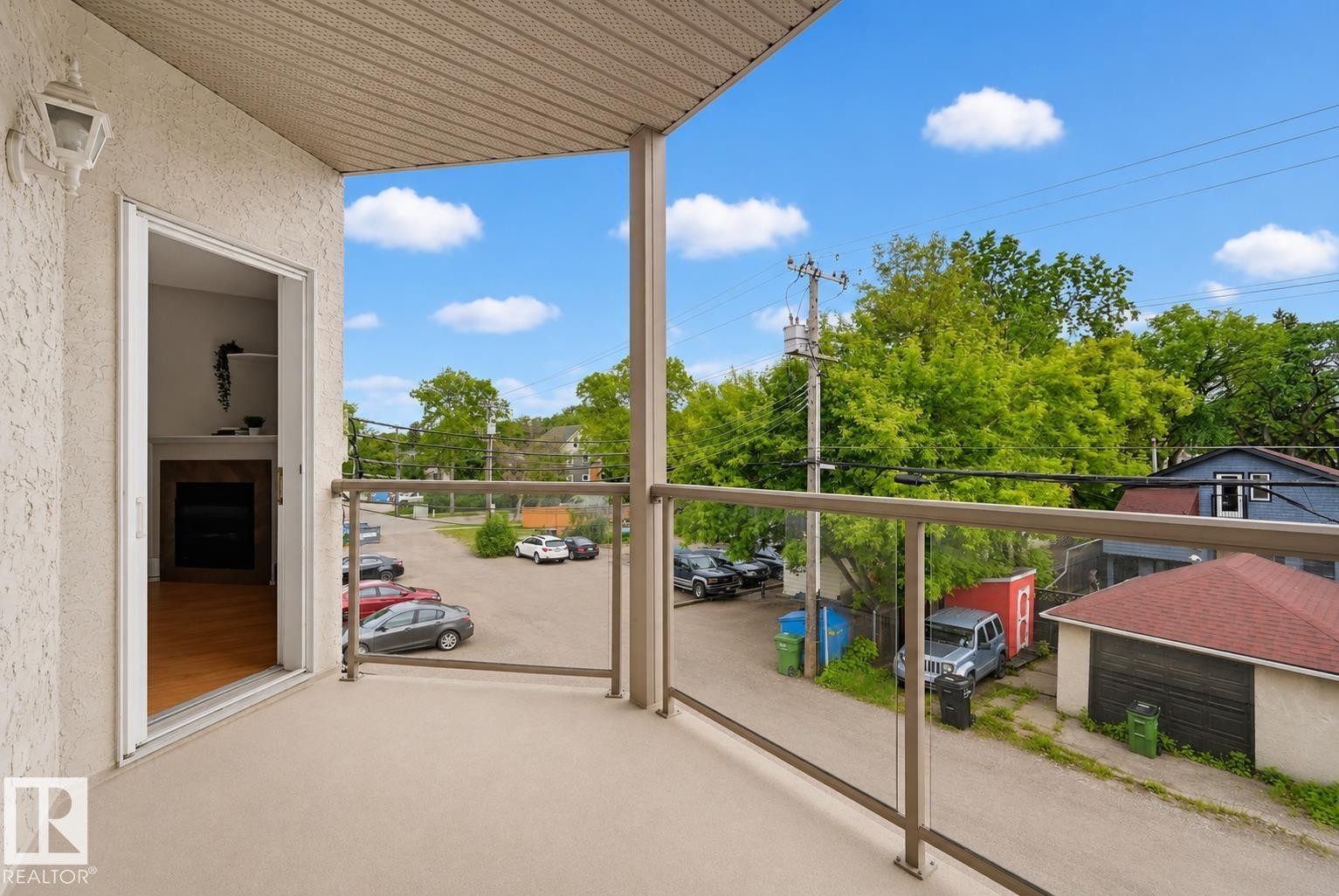 Private balcony featuring glass panel railings - 203 10719 80 Avenue, Edmonton, AB