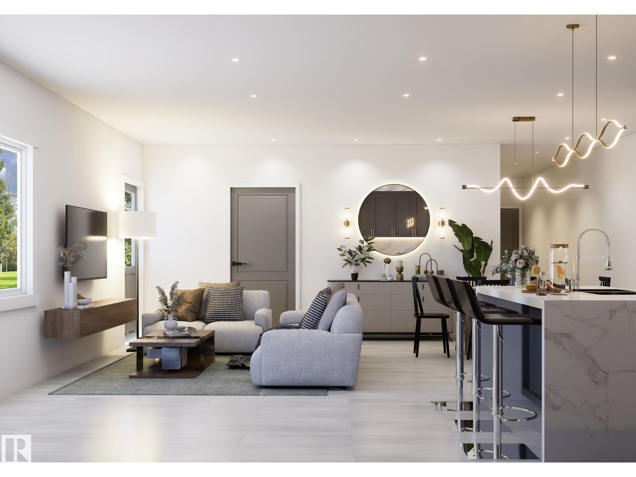 Open-concept living space featuring light wood-finish flooring, recessed lighting, and a modern kitchen island with an integrated sink and bar seating - 10919 106 Ave, Westlock, AB