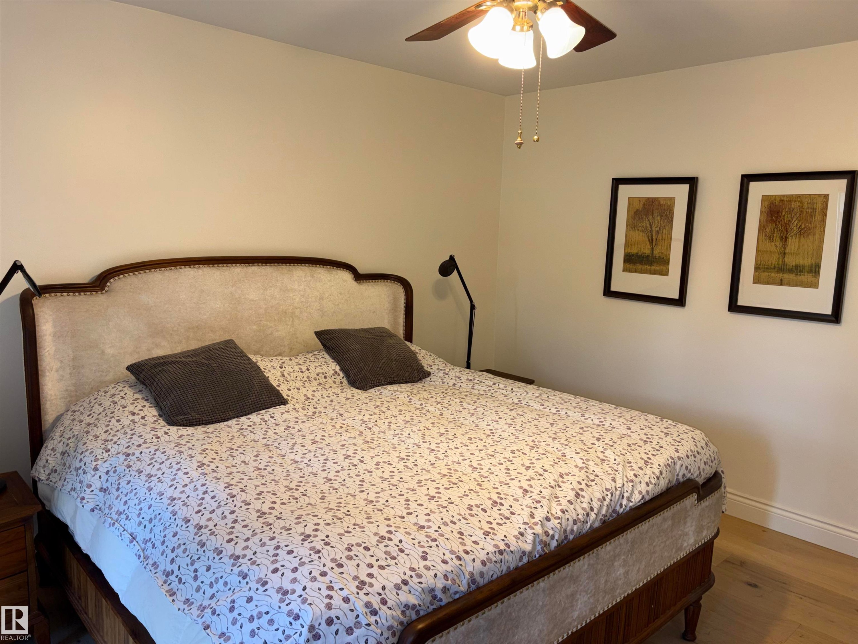 Room featuring light wood-finish flooring and neutral wall tones - 14016 85 Avenue Nw, Edmonton, AB - Indoor Photo Showing Bedroom