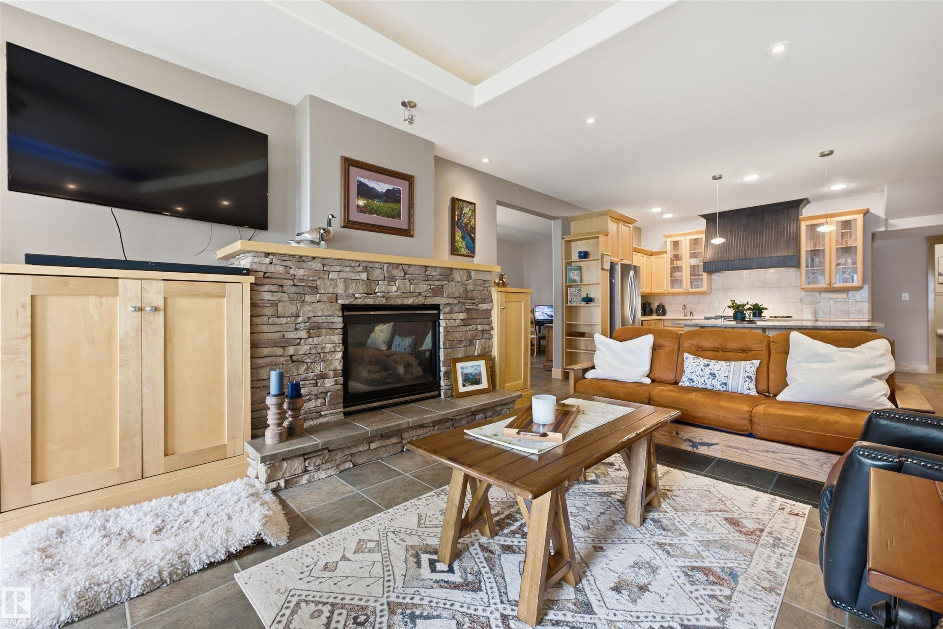 Stone-faced fireplace with a hearth - A38 Bernice Ave, Rural Leduc County, AB