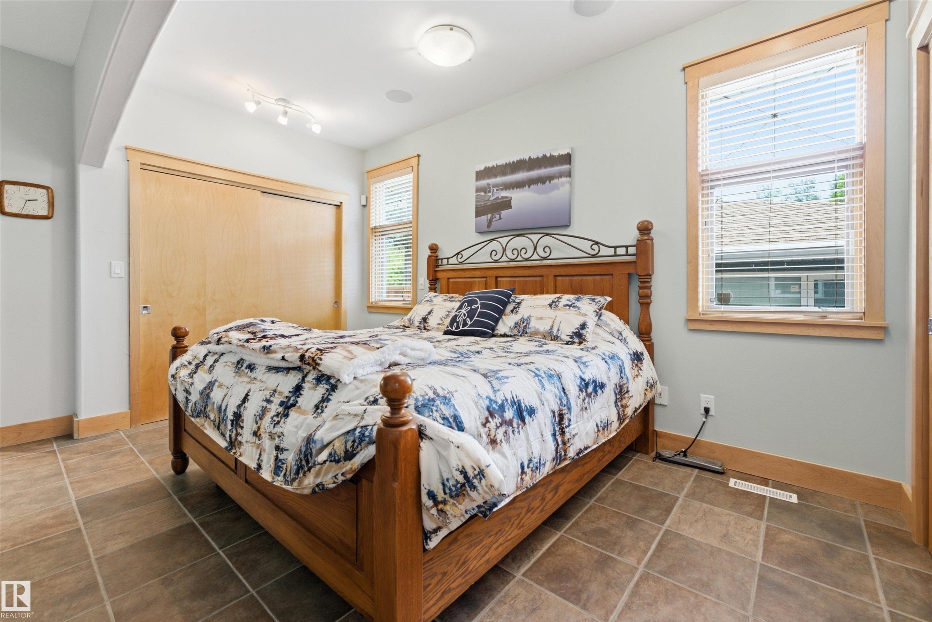 Bedroom with tile flooring and light-toned walls - A38 Bernice Ave, Rural Leduc County, AB