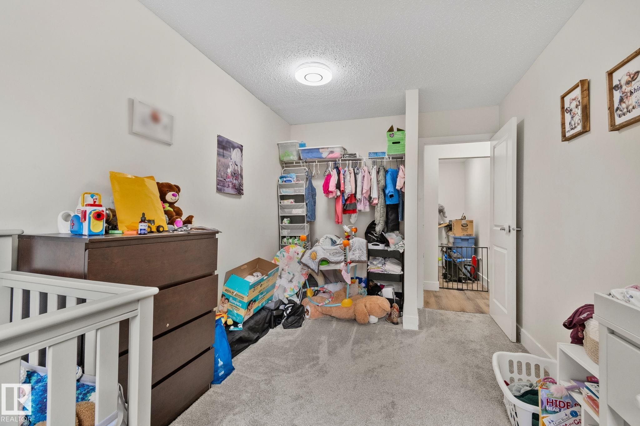 White walls complement light gray carpeting throughout this space - 115 4608 52 Avenue, Stony Plain, AB