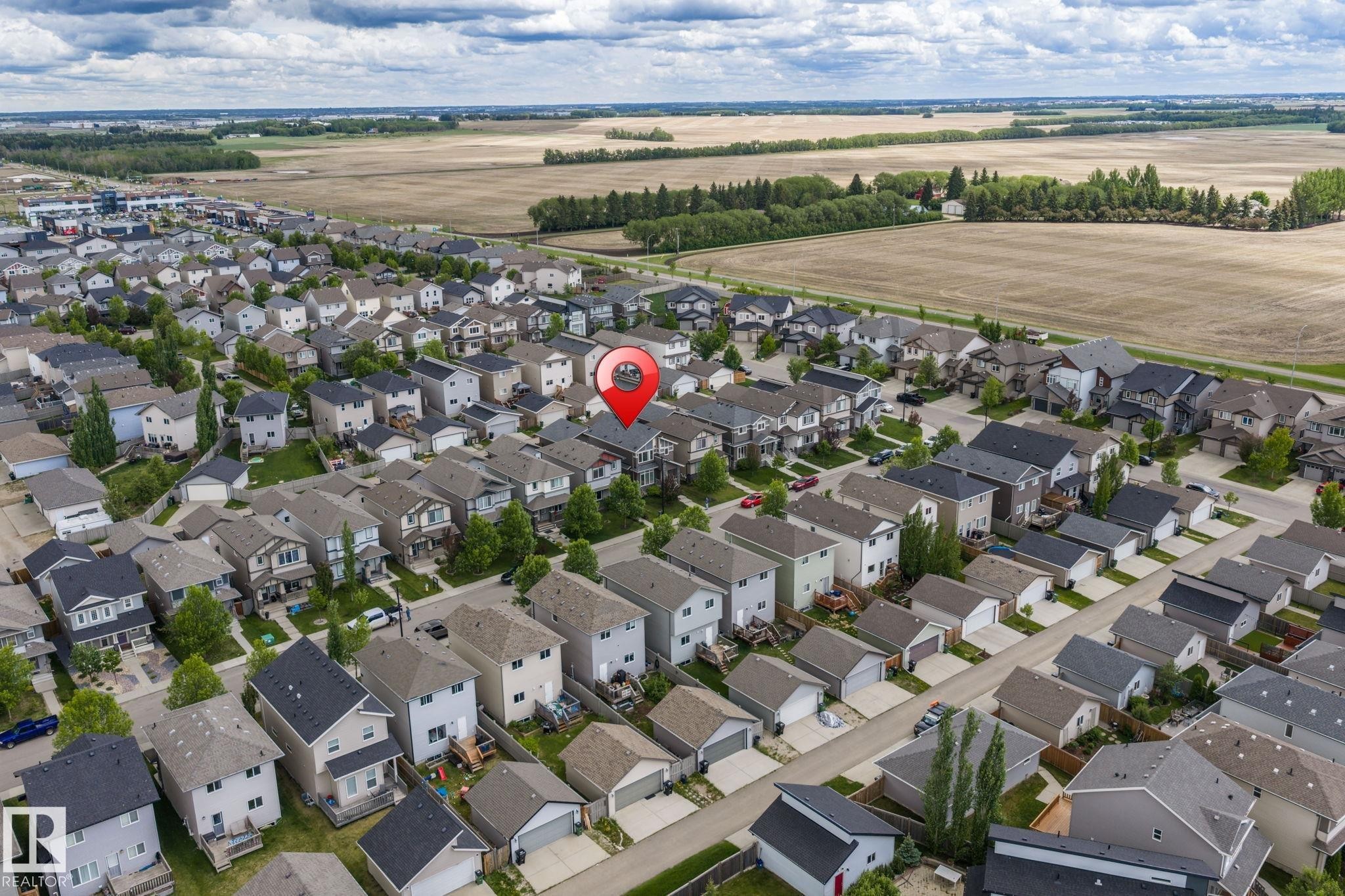 Residential neighborhood featuring a grid-patterned street layout and uniform-sized lots - 6927 Cardinal Wynd Sw, Edmonton, AB - Outdoor With View
