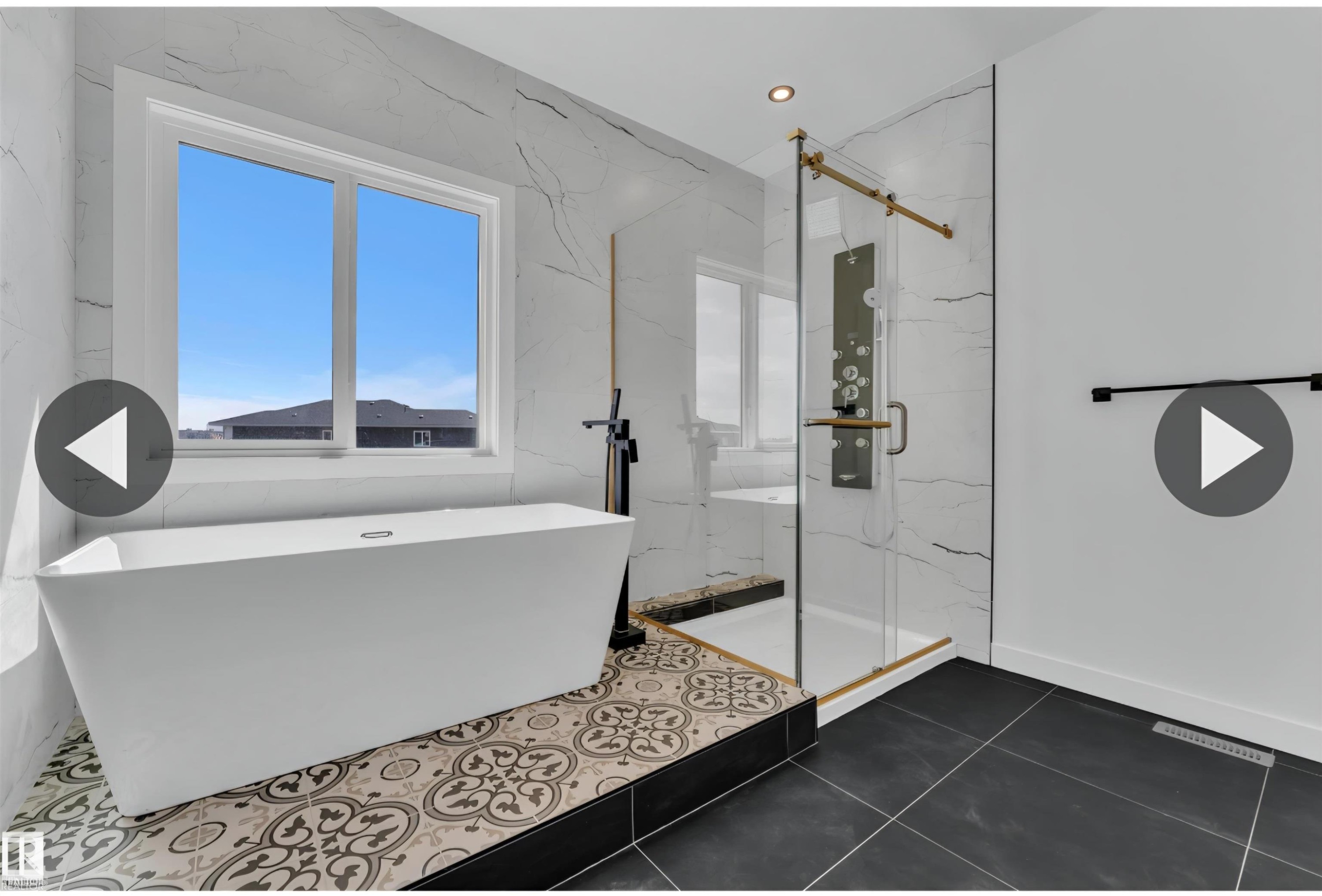 Freestanding soaking tub with a patterned tile surround - 13140 187 Avenue, Edmonton, AB